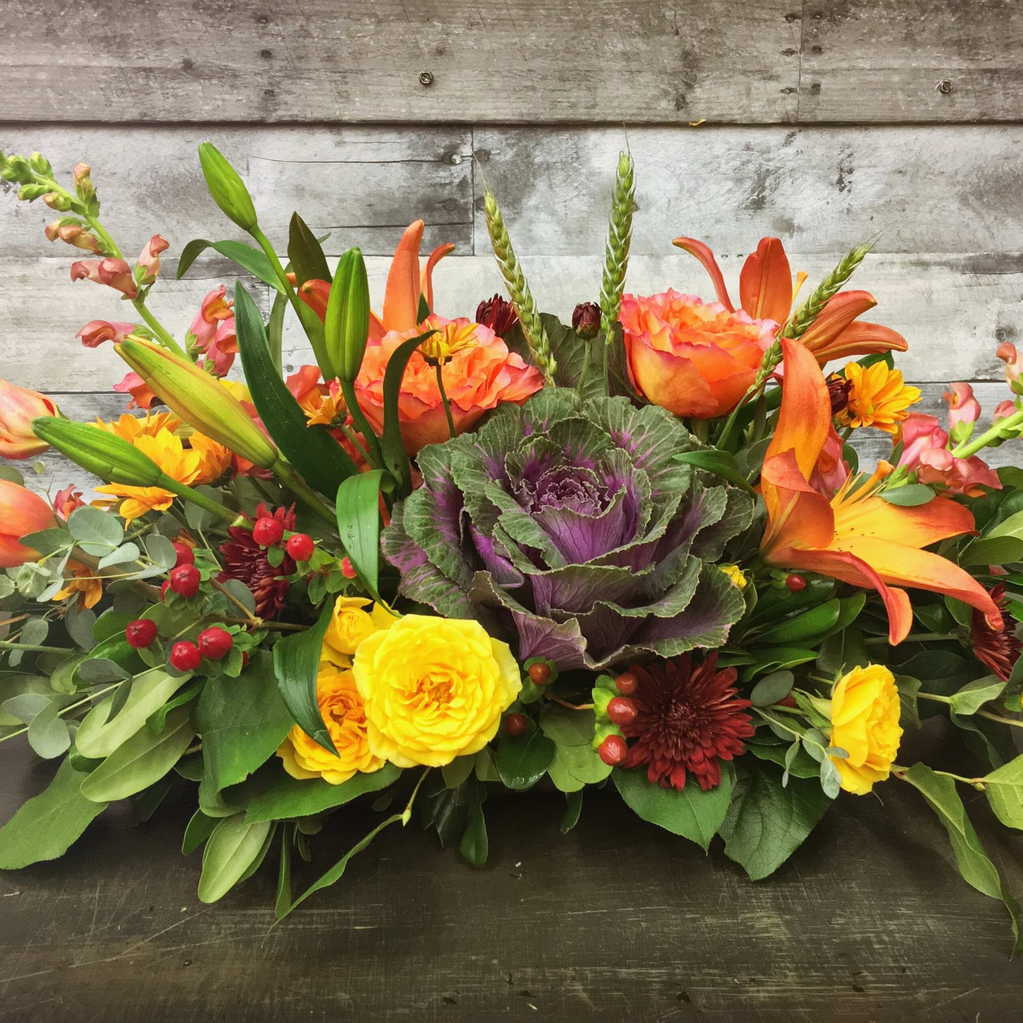 A lovely centerpiece with all the splendor of fall!  Kale, lilies