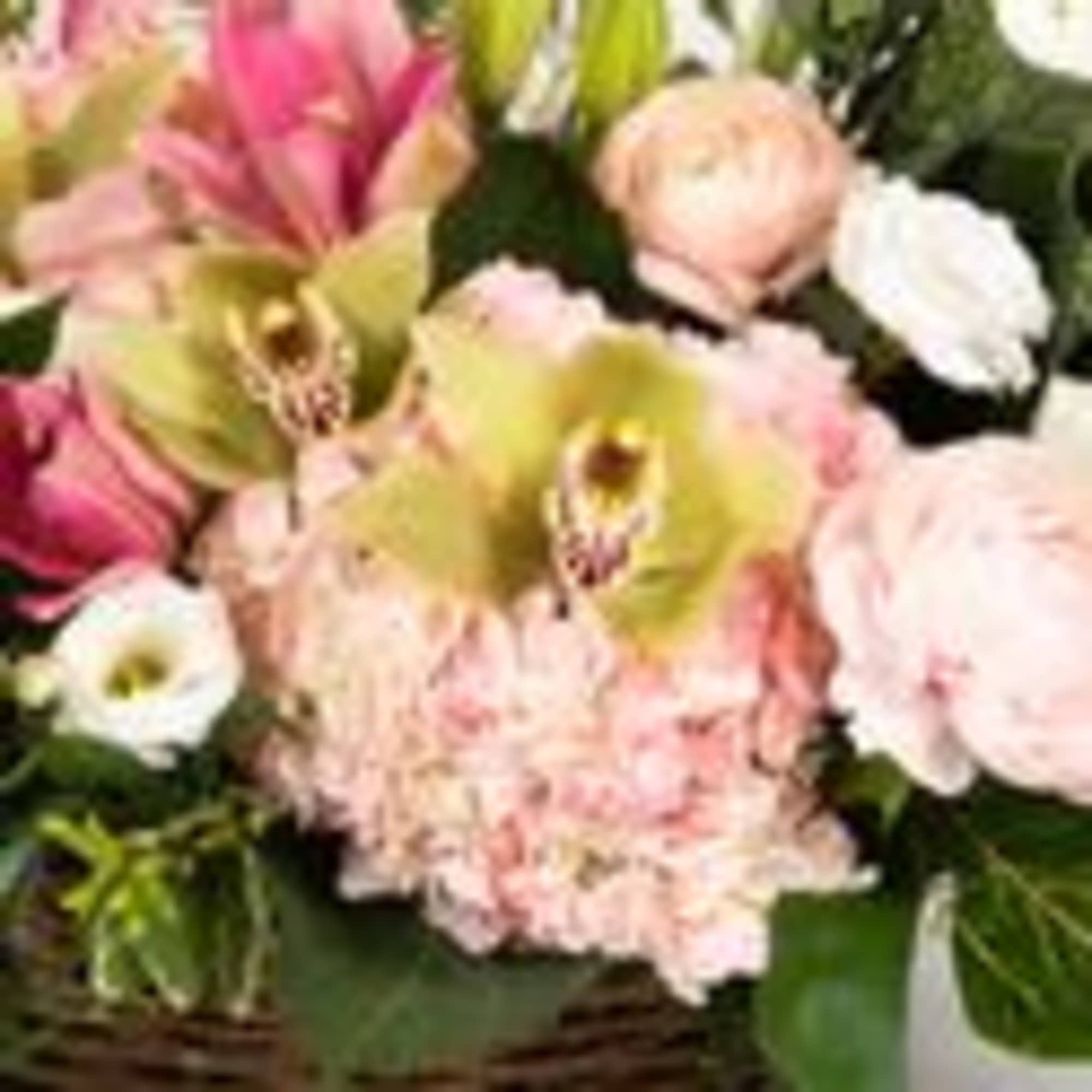 Bouquet of pink and white flowers with green orchids