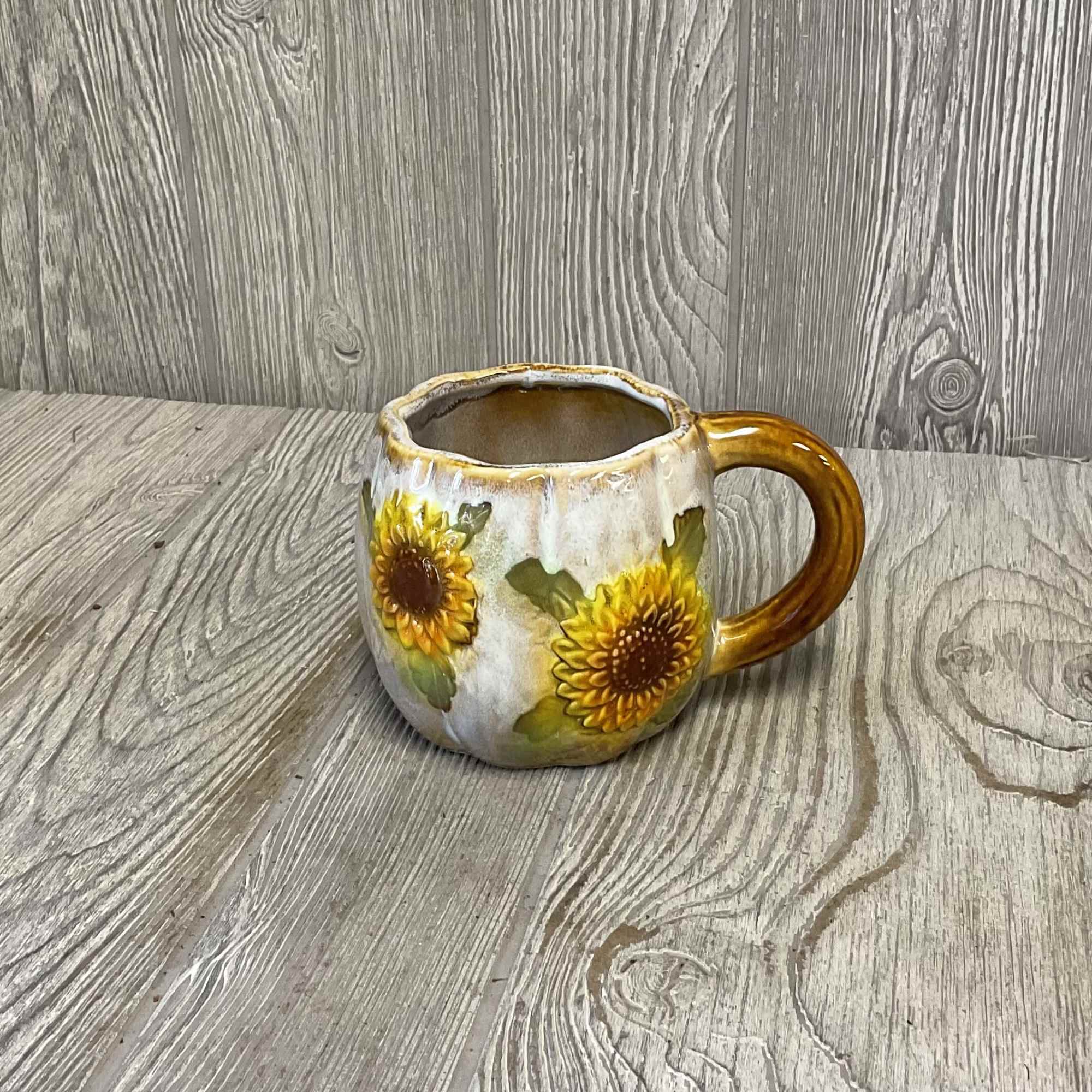 Sunflower-decorated ceramic mug with a handle