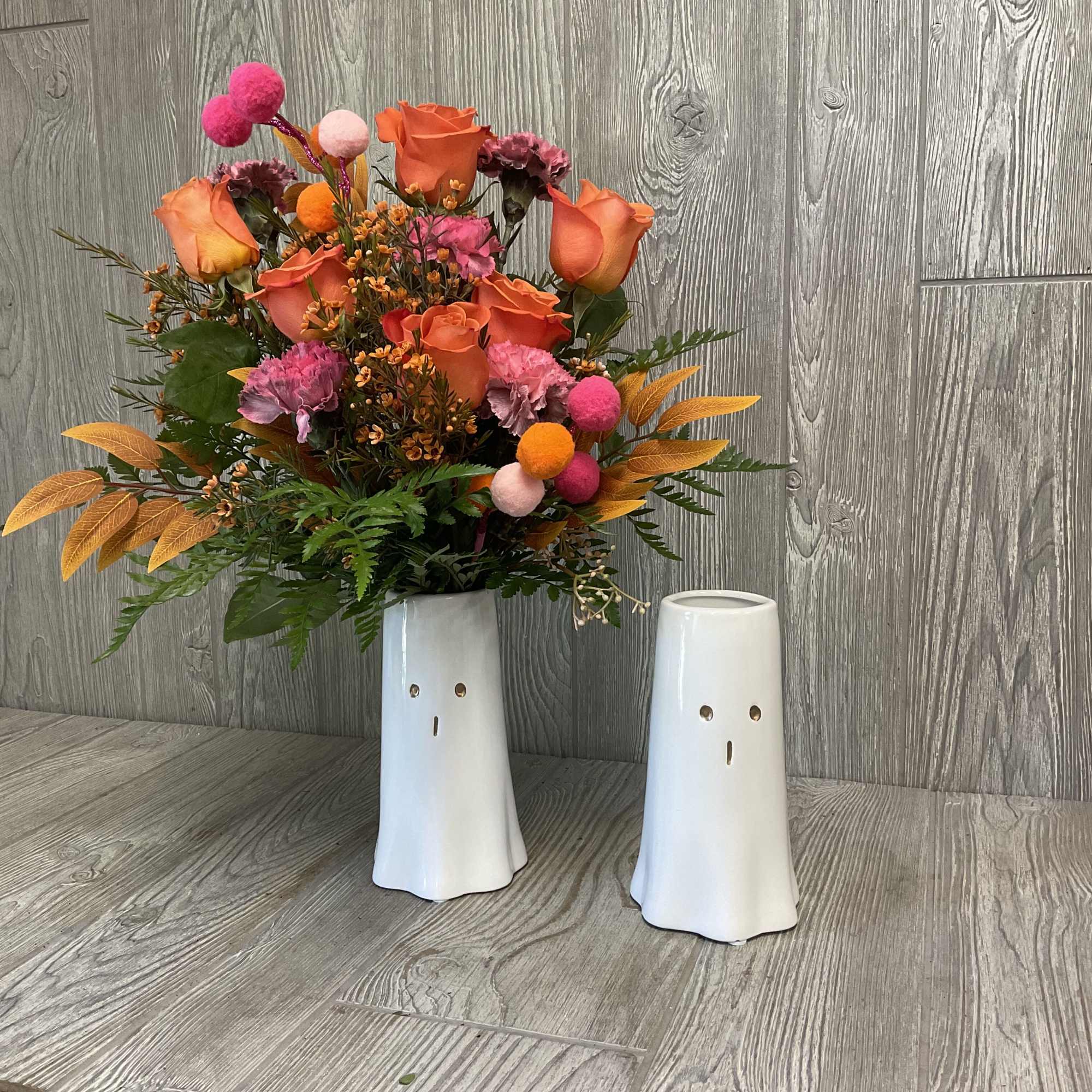 A festive Halloween Arrangement inside of a reusable Ghost container!