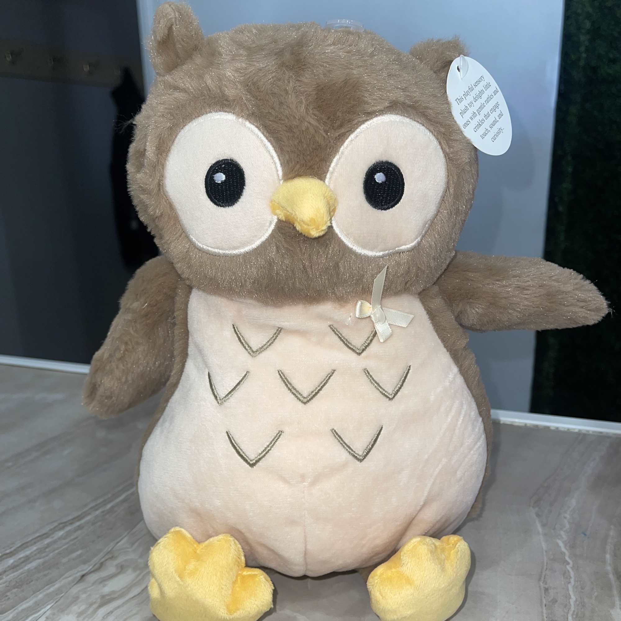 Plush owl stuffed animal with large eyes and yellow feet