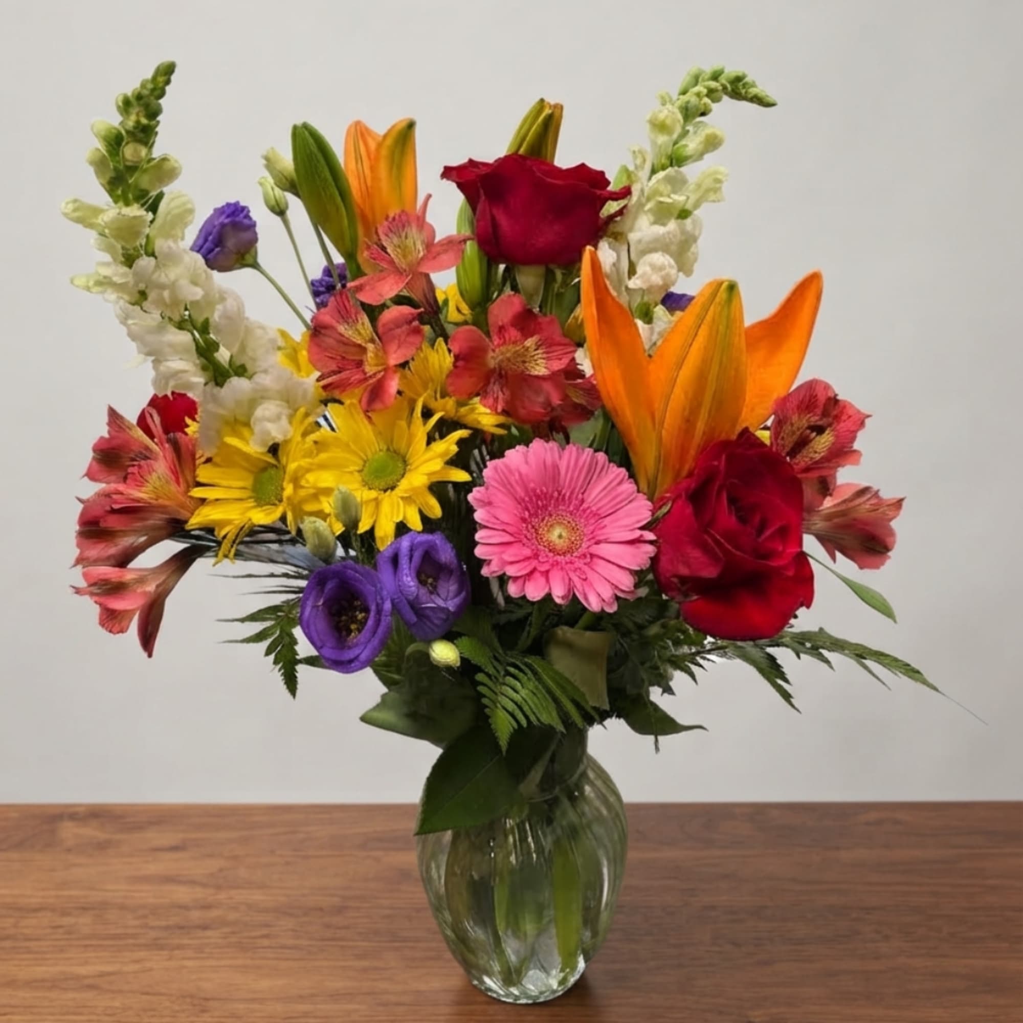 Colorful mixed bouquet in a clear glass vase