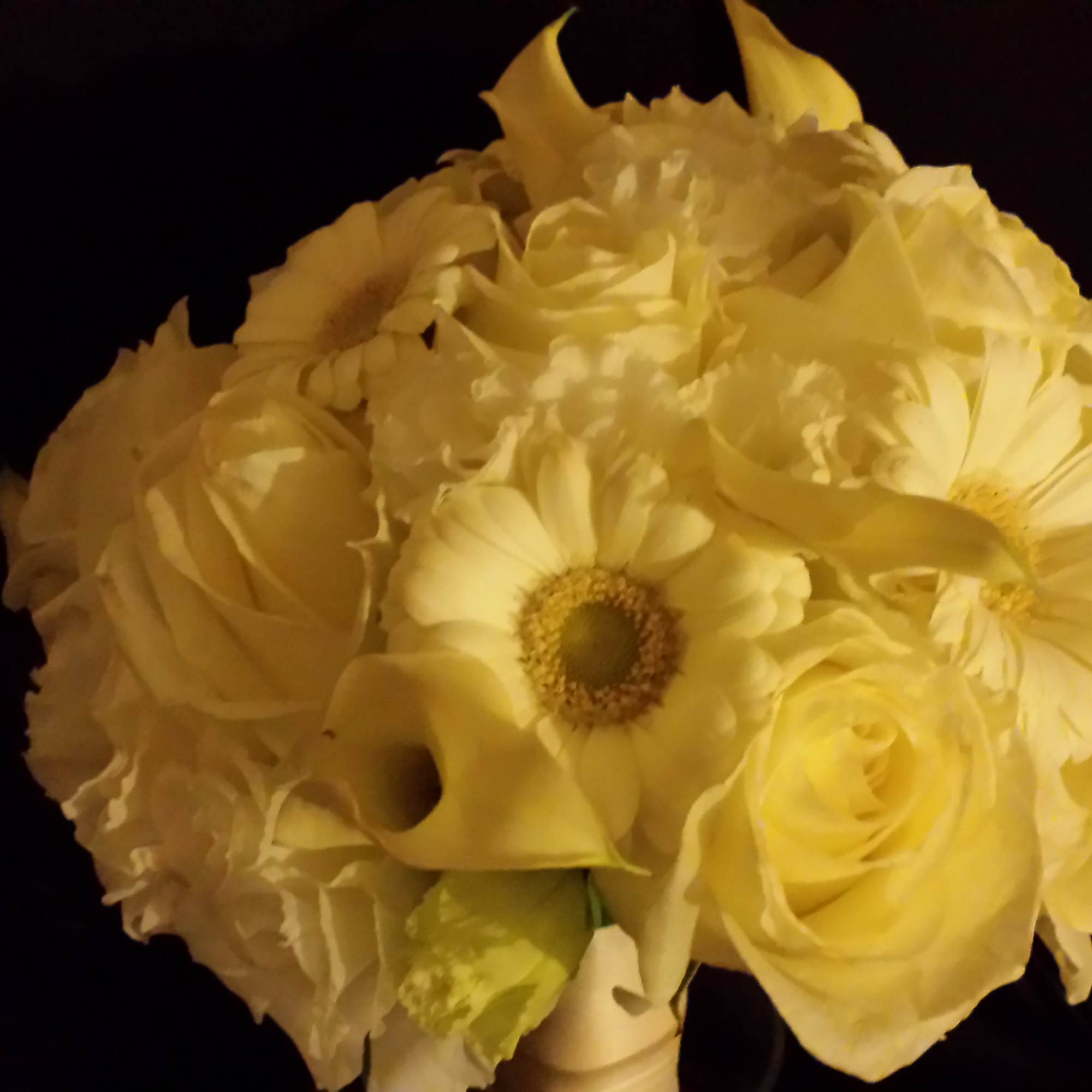 Creamy white bouquet with roses, calla lilies, and daisy-like blooms