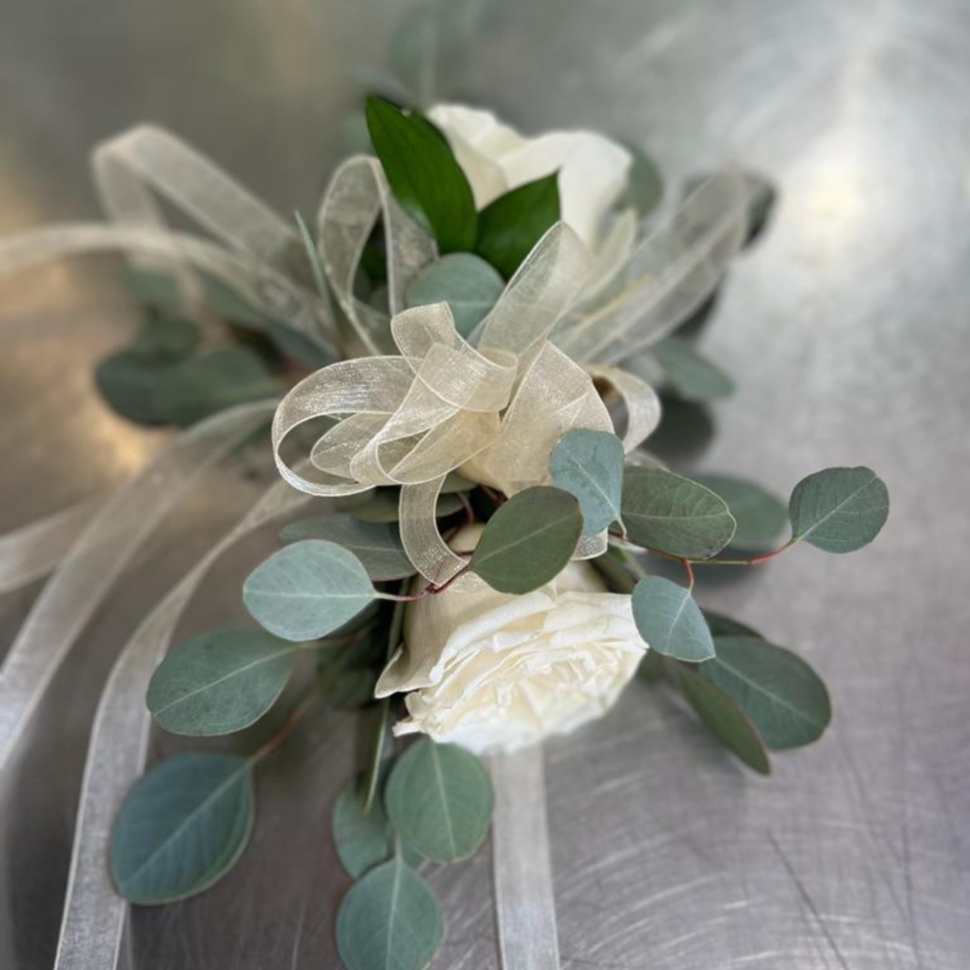 White rose boutonniere with eucalyptus and sheer ribbon, photo 2 of 4