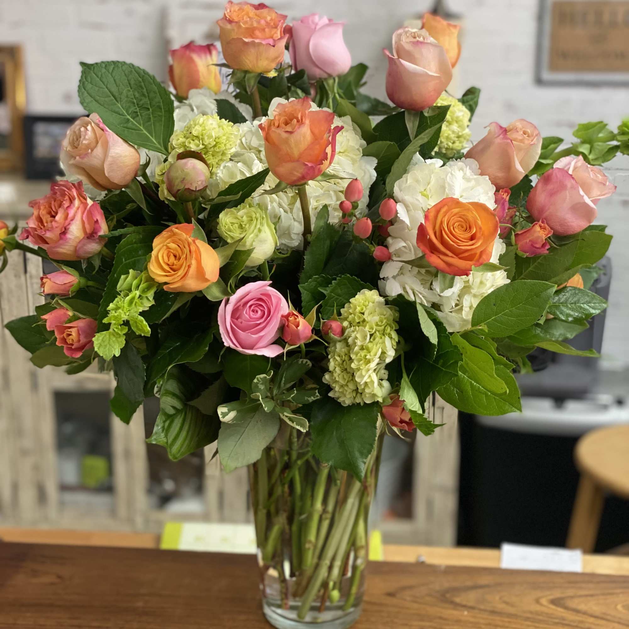 Bright pinks &amp; oranges, a colorful mix in tall glass vase