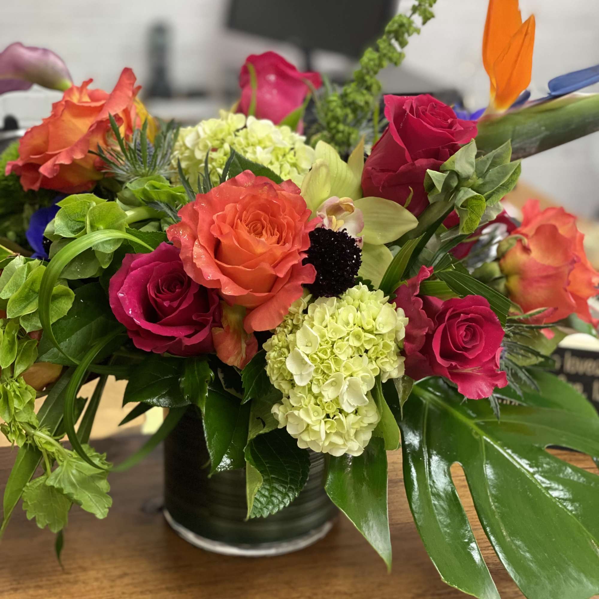 Uniquely made tropical mix of exotic blooms and traditional flowers in a, photo 3 of 3