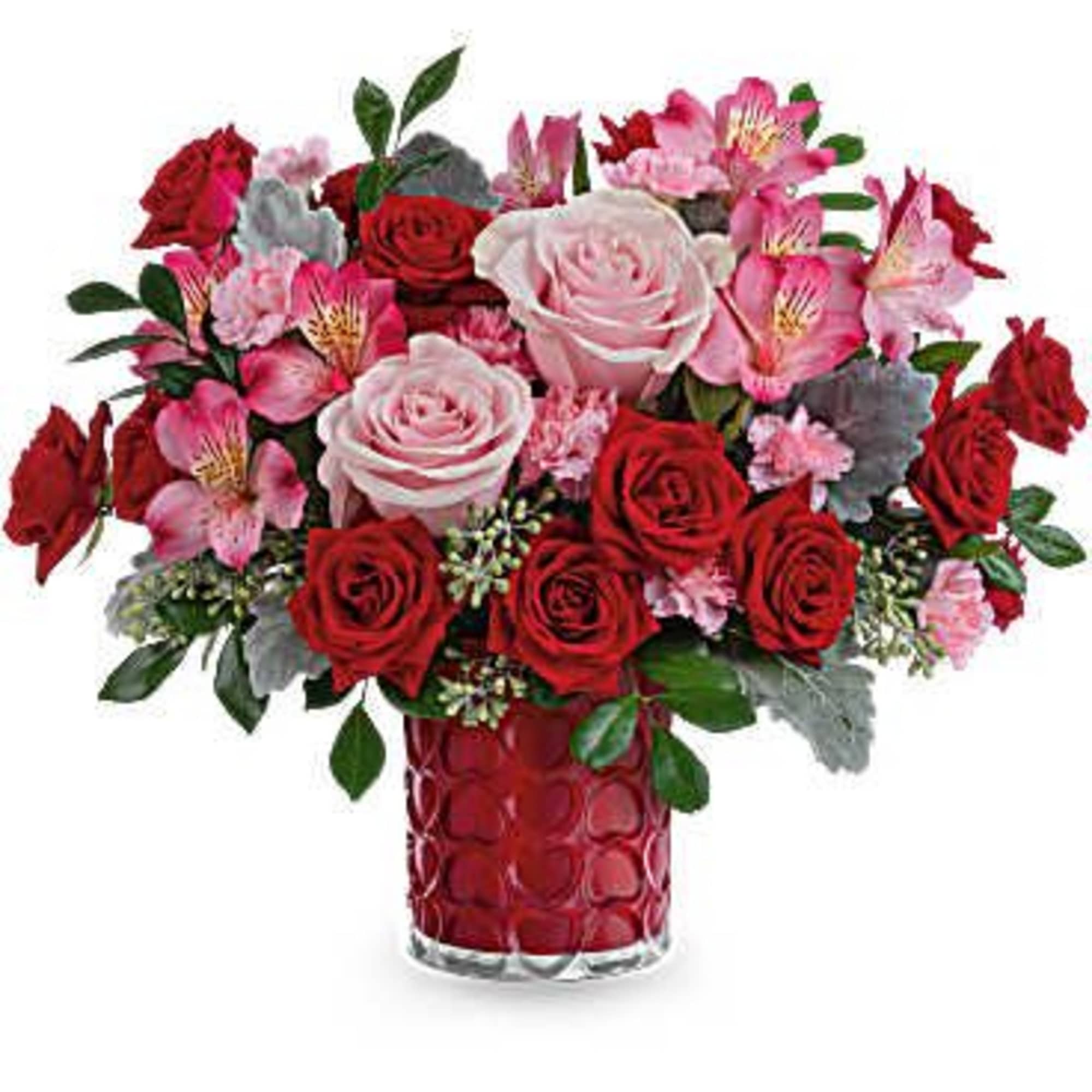 Bouquet of red and pink roses with alstroemeria in a red glass vase