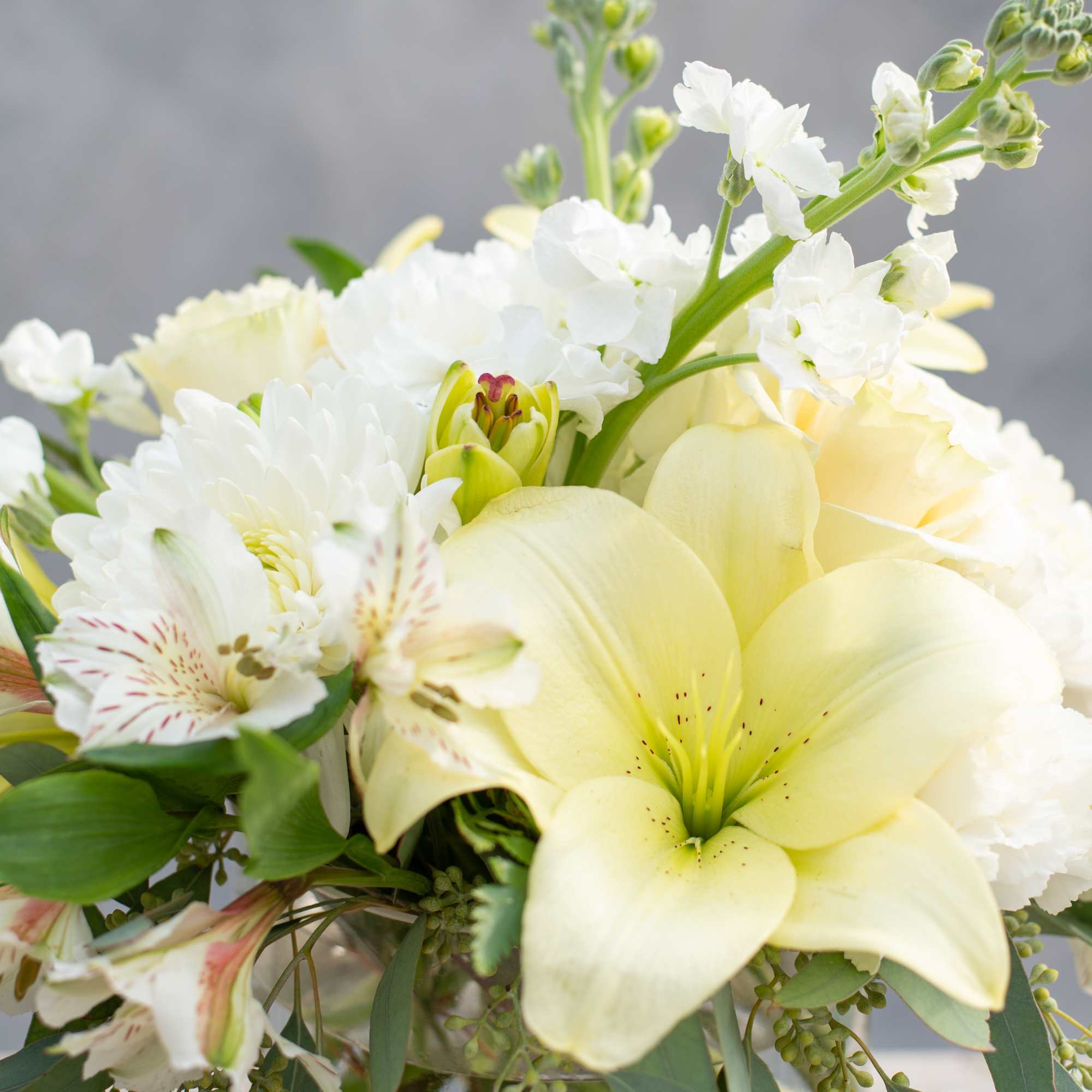 Bouquet of pale yellow lilies and white flowers