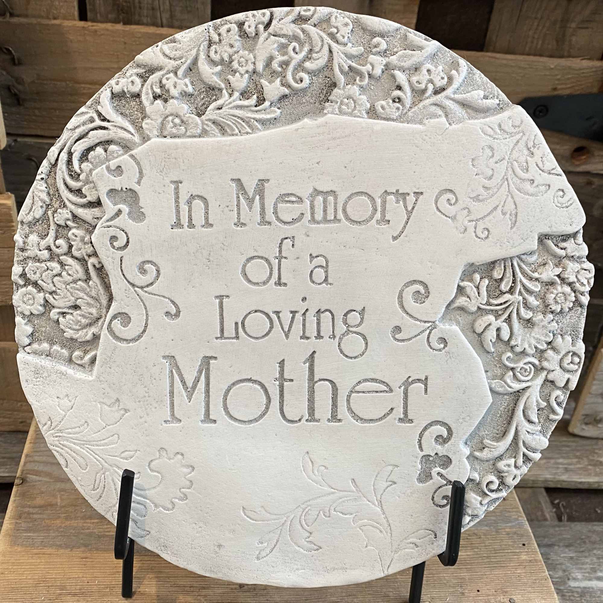Decorative memorial plaque reading "In Memory of a Loving Mother"