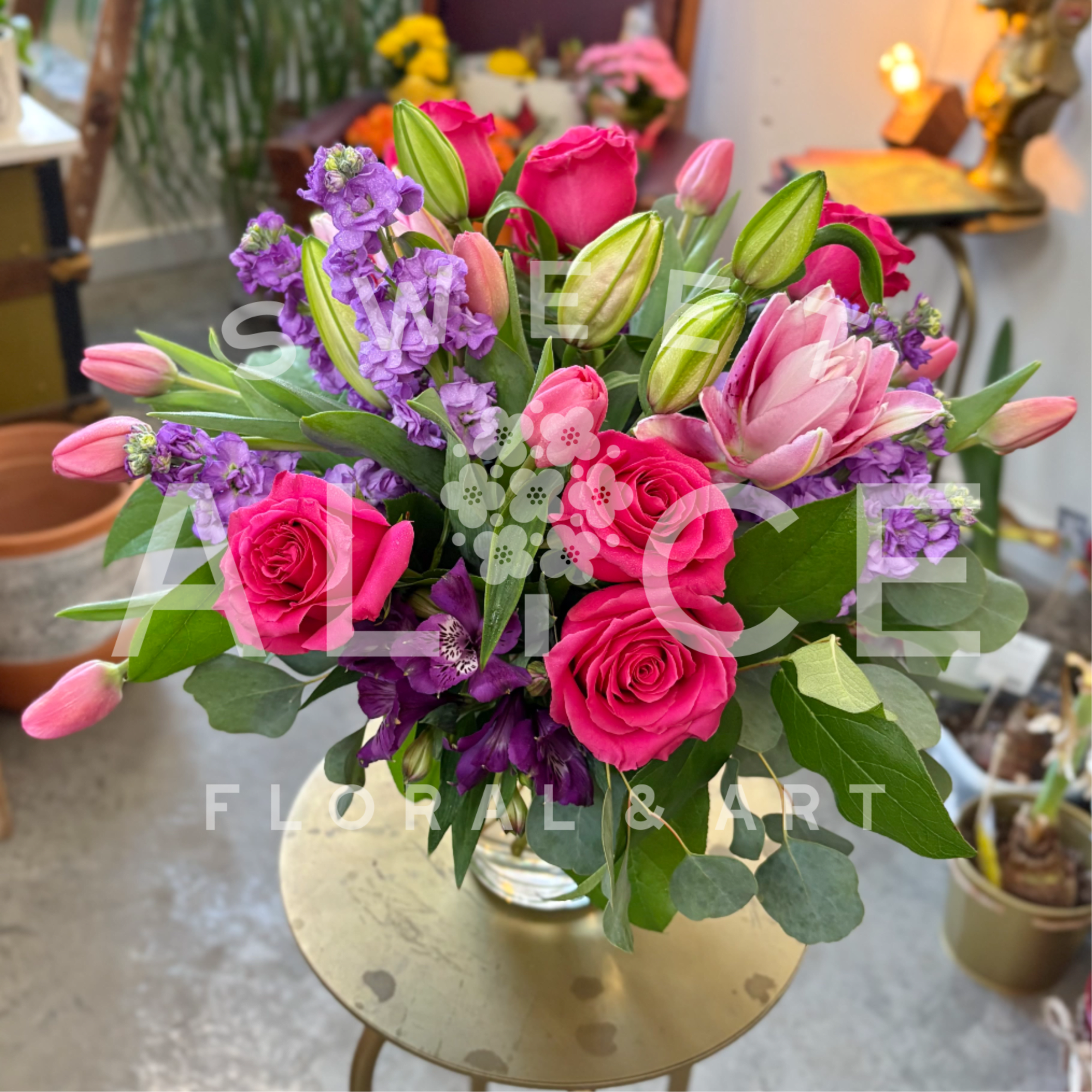 A delightful mixture spring colors, this arrangement is certain to put a