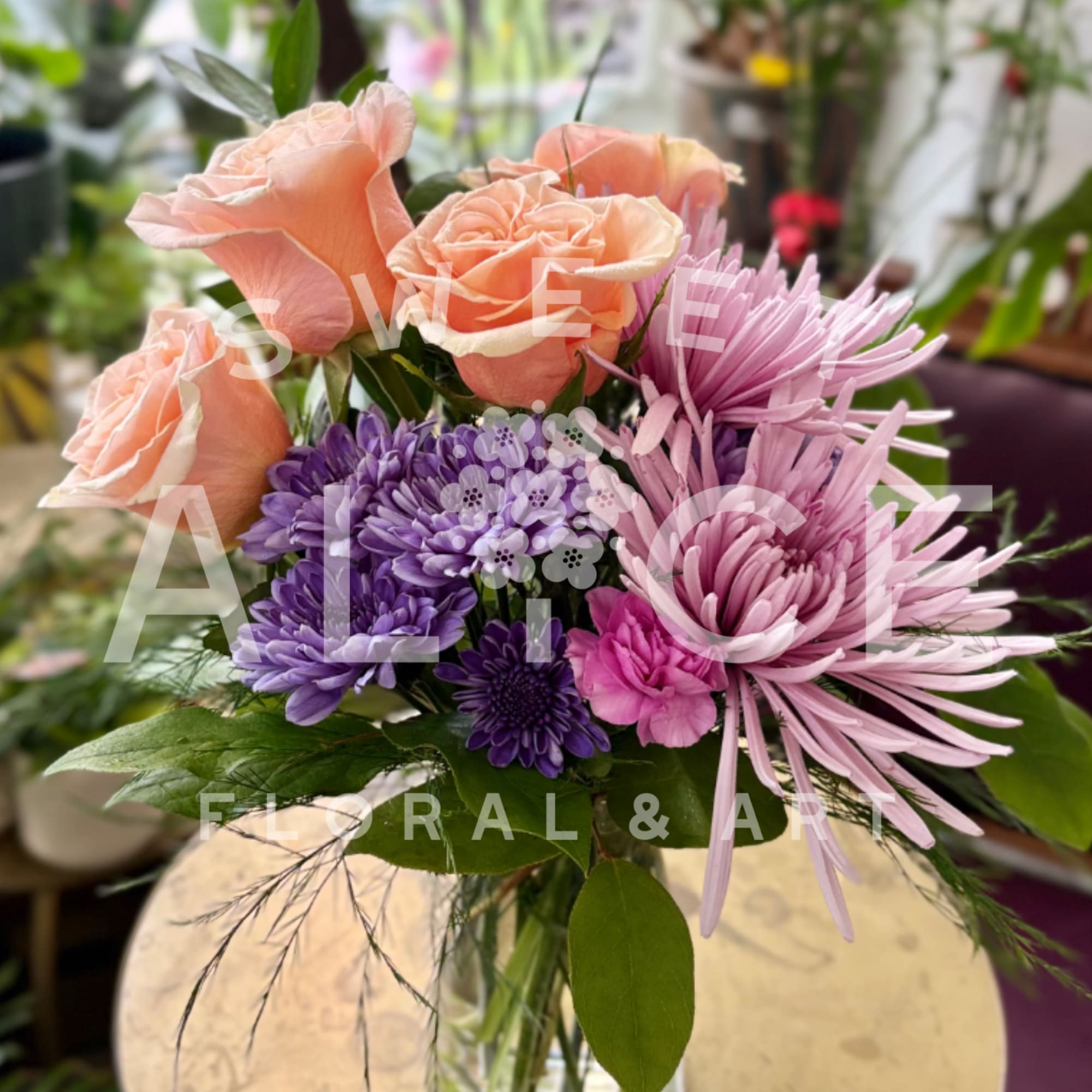 Roses, daisies, carnations and mums, this arrangement is popping with joyful spring