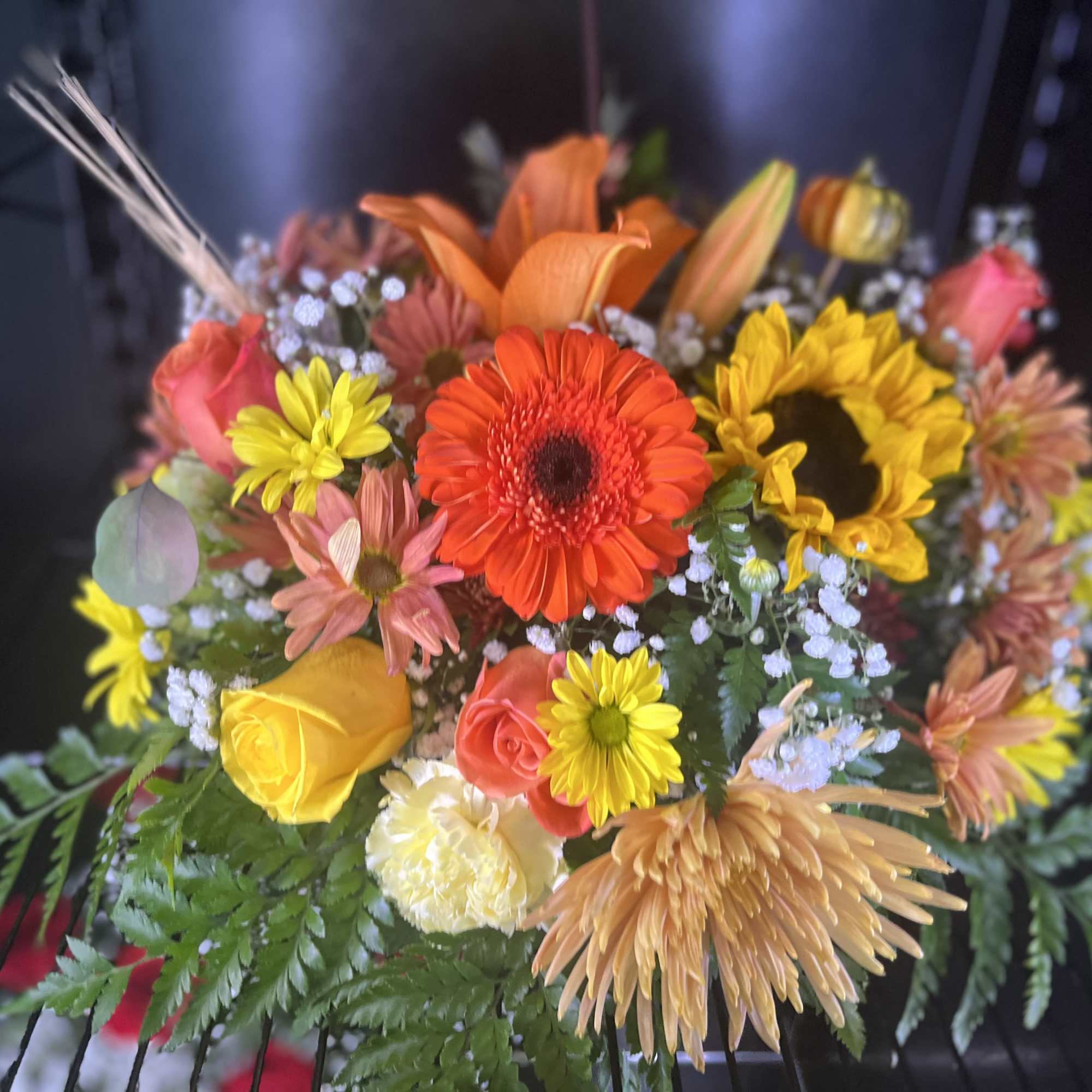 Mixed bouquet with sunflowers, roses, and gerbera daisies