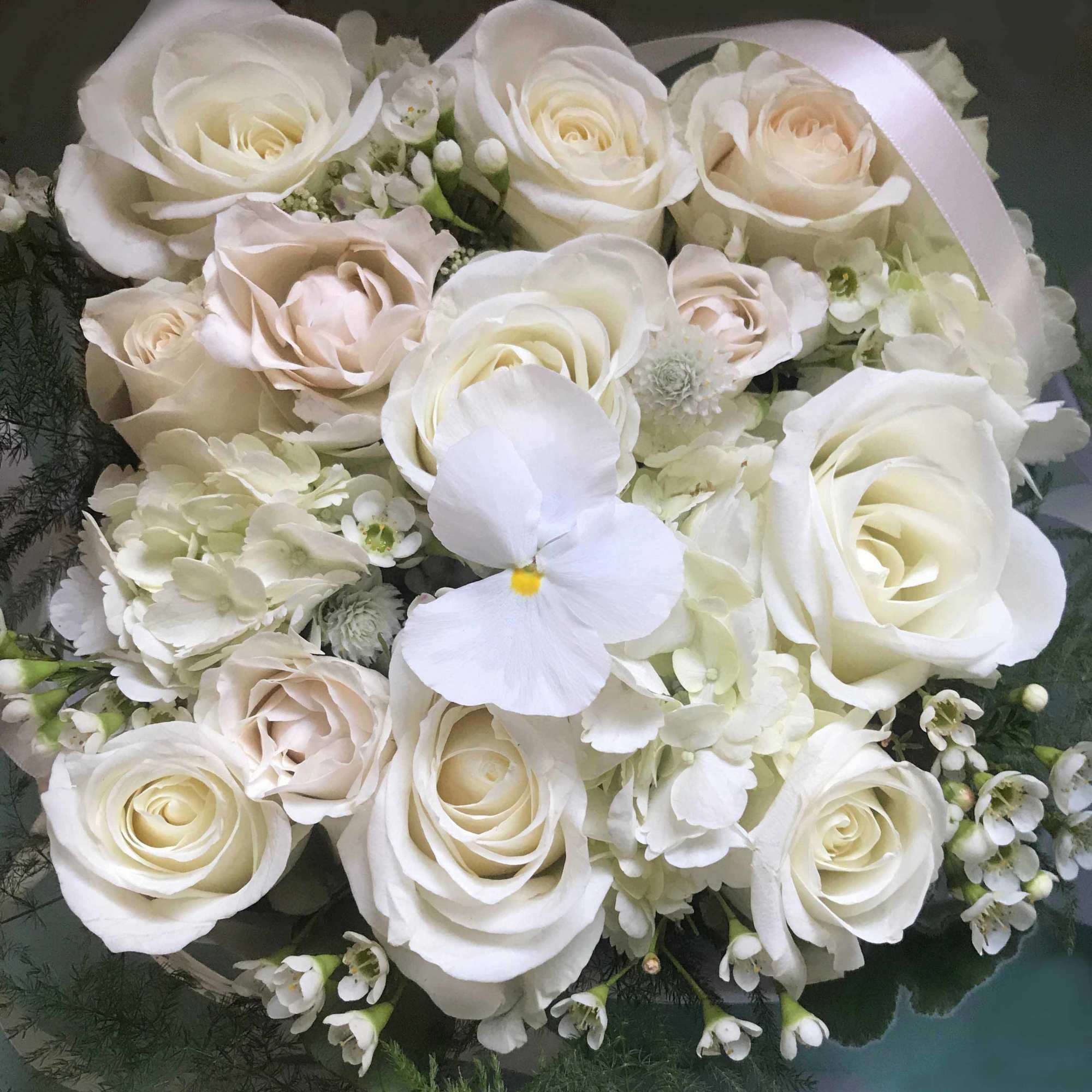 Beautiful blooming flower box full of fresh flowers in a white and, photo 2 of 4