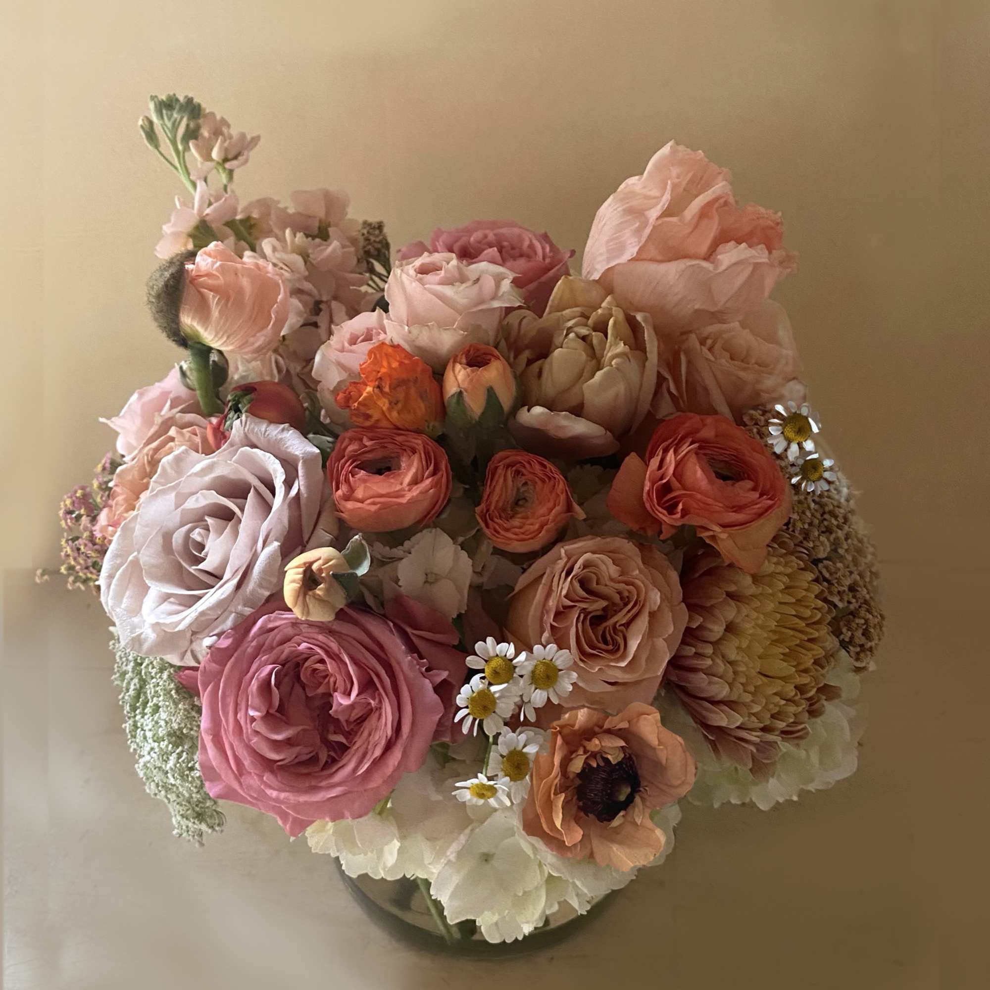 Sunset colors of orange, brown, coral, mustard and golden pastels adorn this