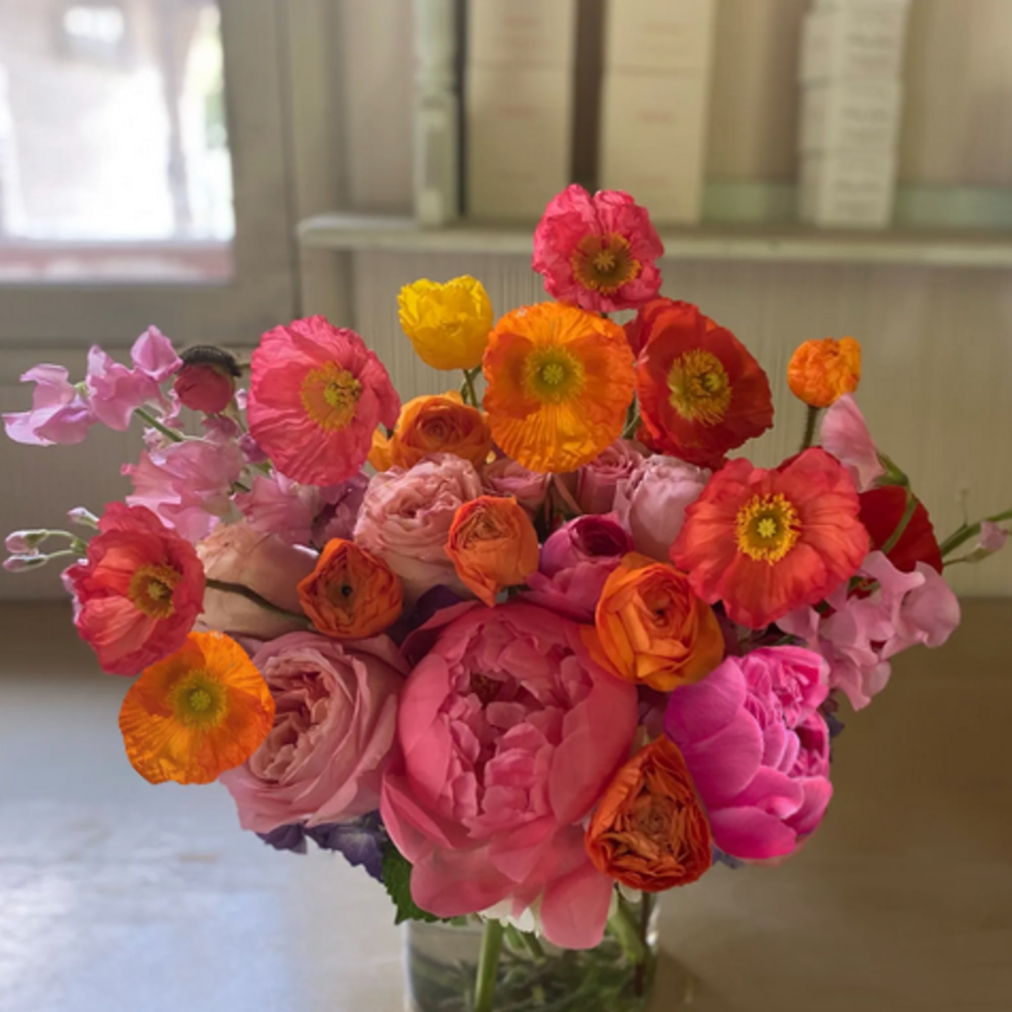 Lively and bright Holiday arrangement of gorgeous warm and vivid colors of
