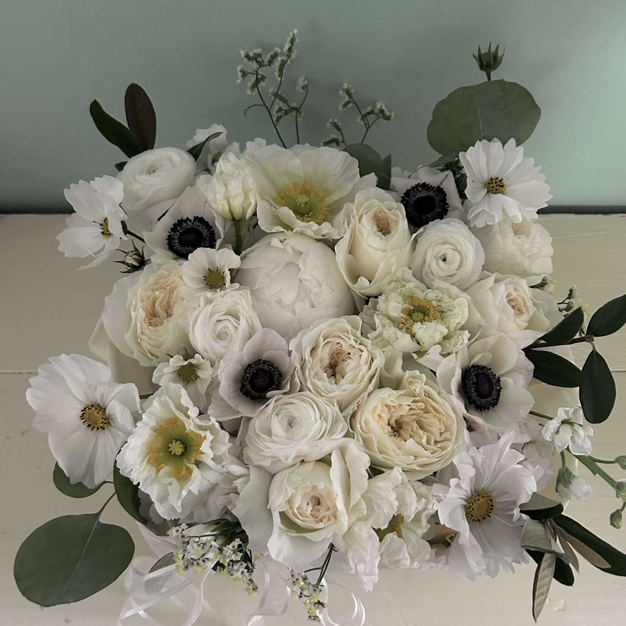 White bouquet with roses and cosmos flowers