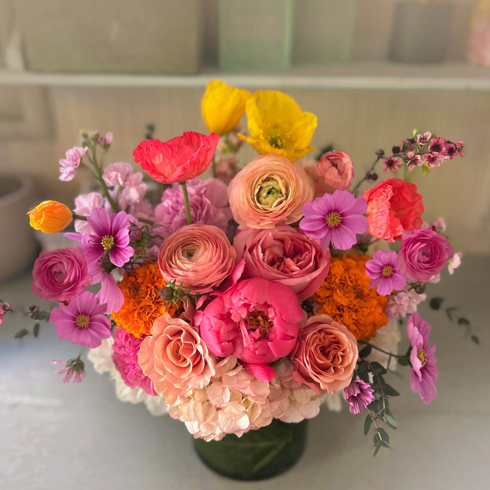 Lively and bright Holiday arrangement of gorgeous warm and vivid colors of
