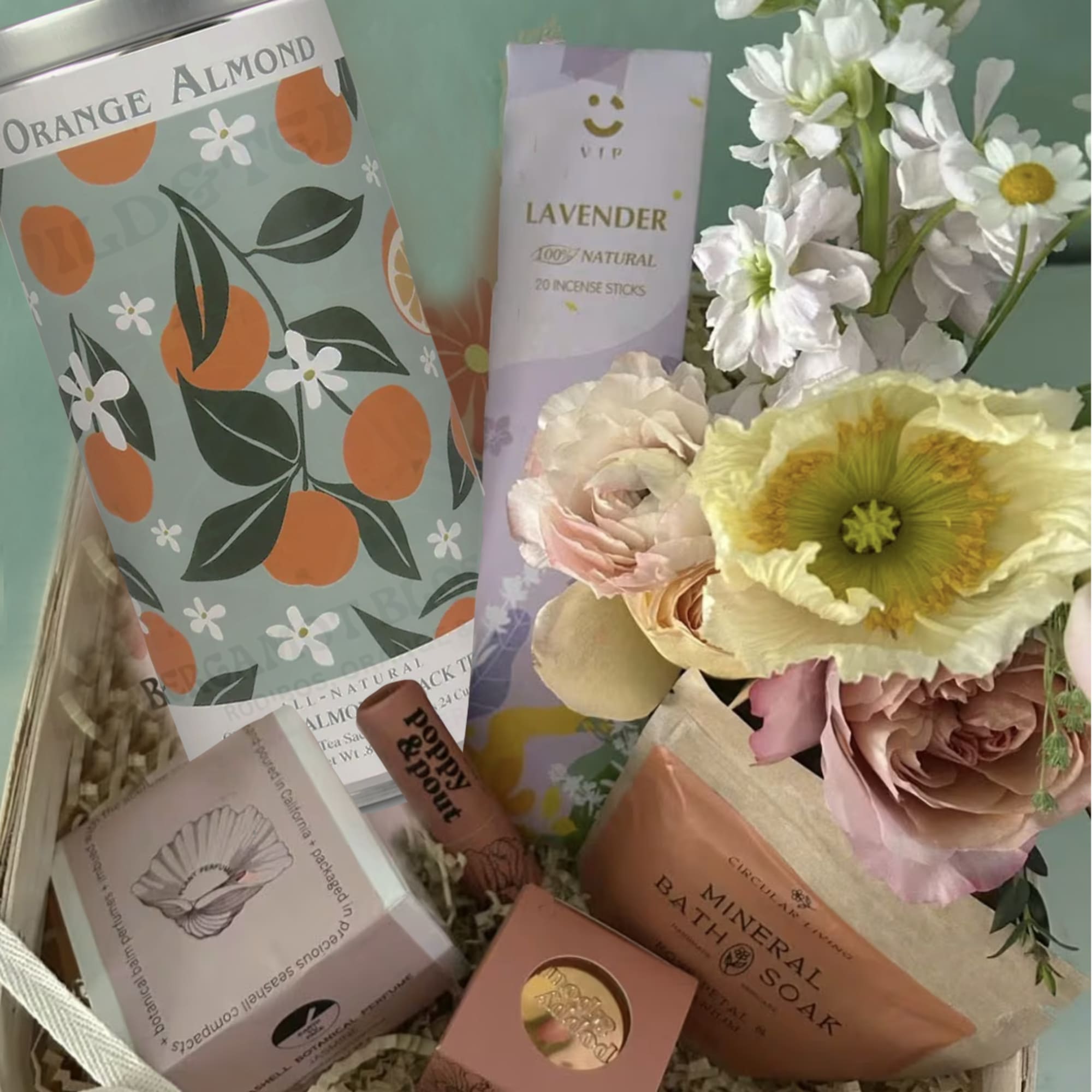 Gift basket with flowers, incense, soap, and packaged treats