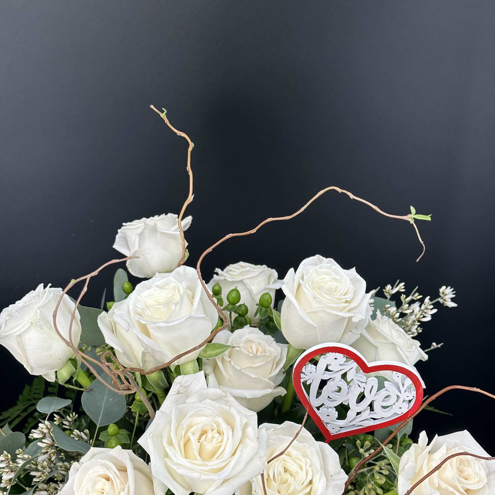 White rose bouquet with a red heart decoration