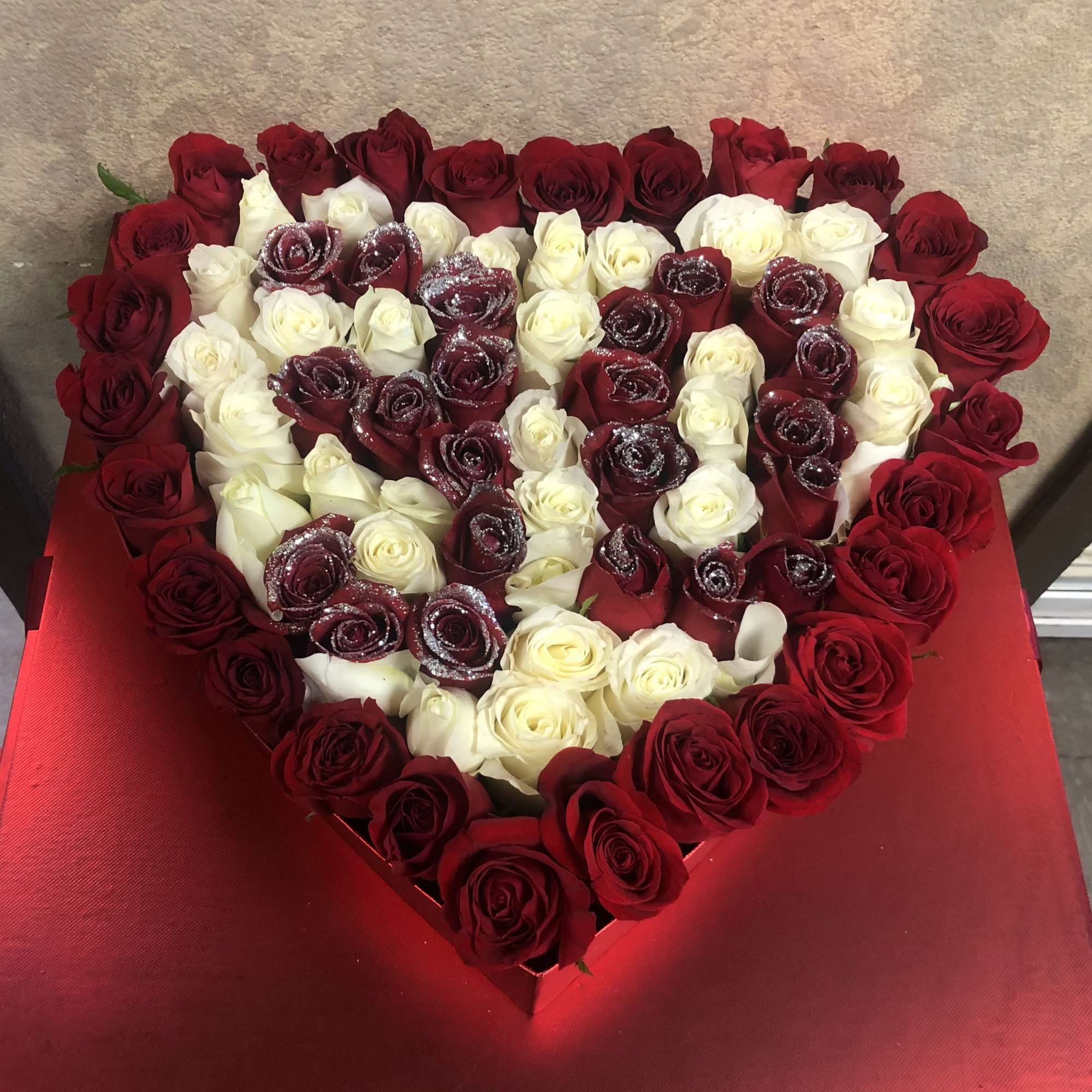 Heart-shaped box filled with red and white roses, photo 2 of 3