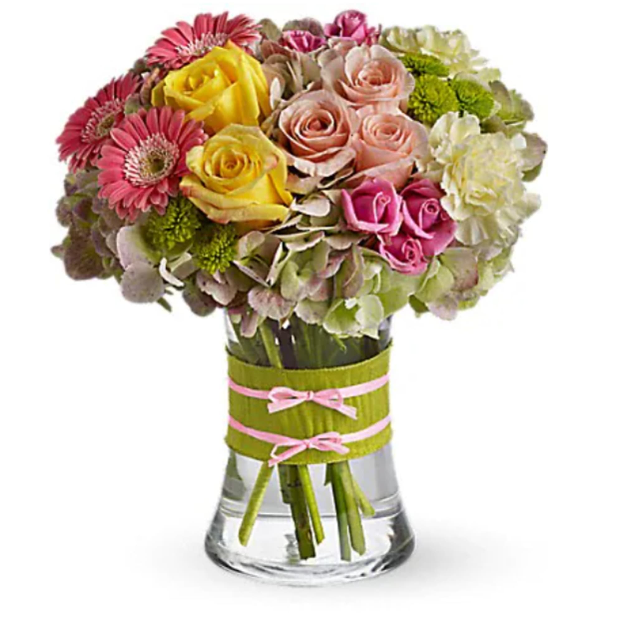 Mixed bouquet of roses, gerbera daisies, and hydrangeas in a glass vase