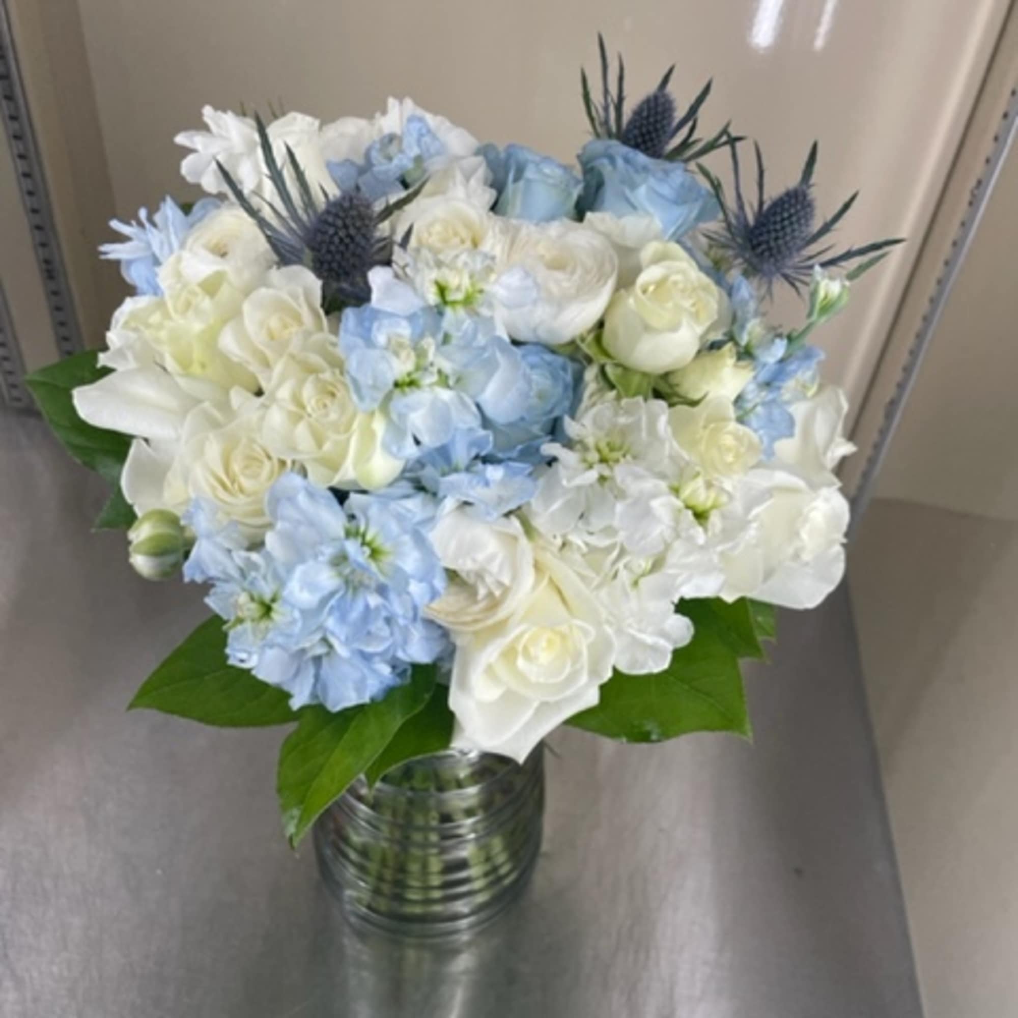 Blue and white bouquet in a glass vase