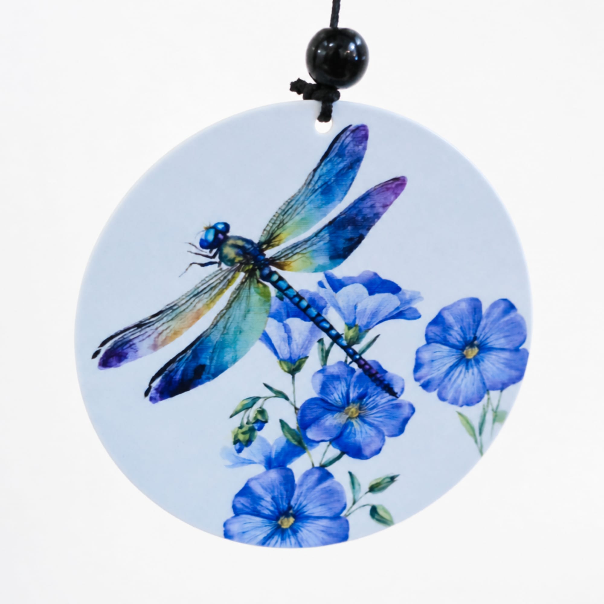 Round hanging ornament with a blue dragonfly and blue flowers