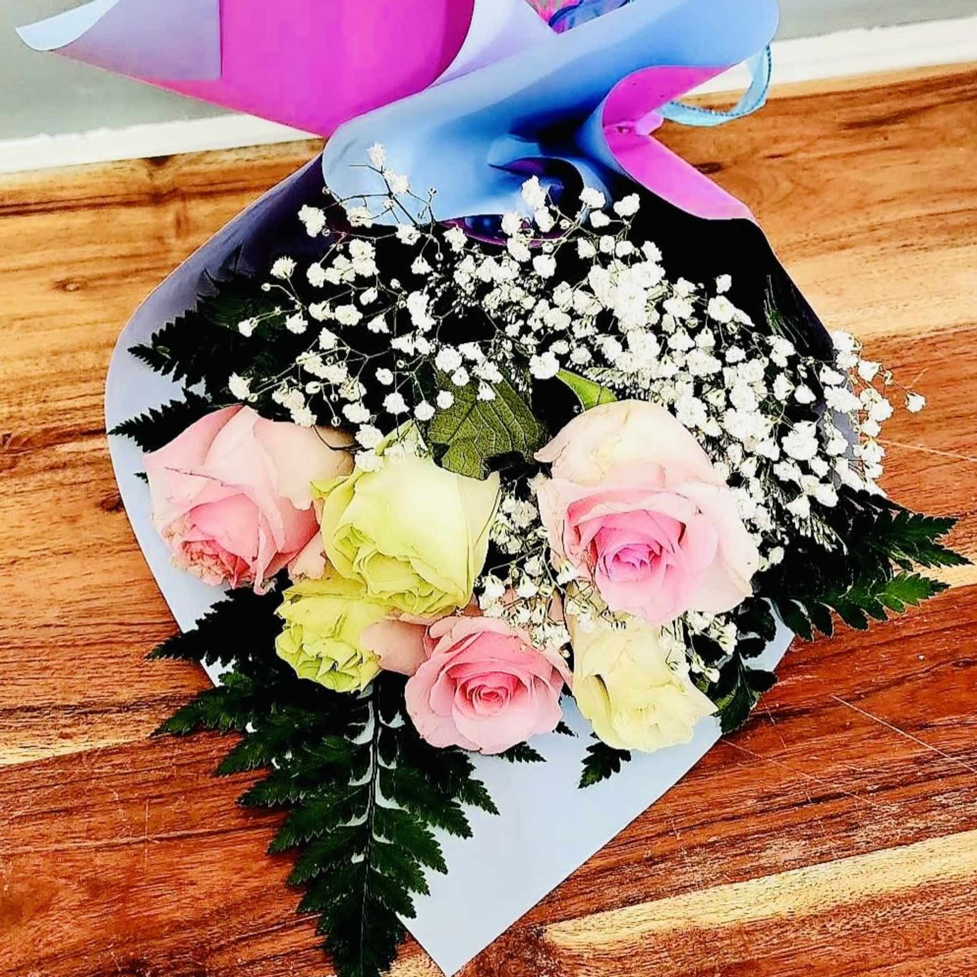 A lush cluster of half a dozen roses makes a quietly powerful