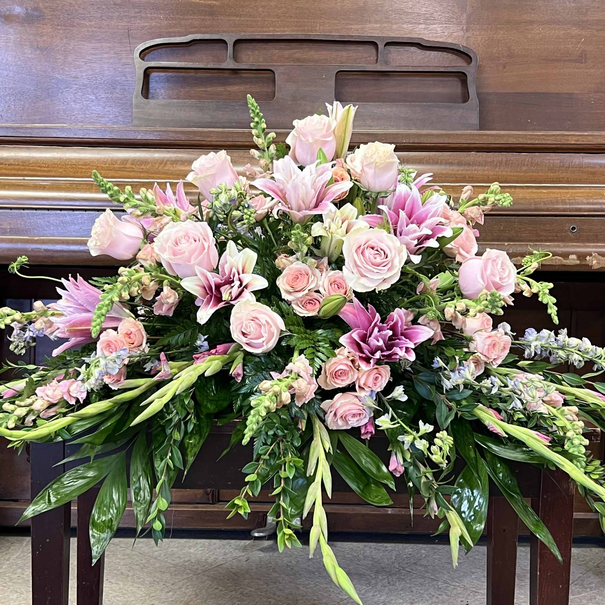 All pink casket spray in Olive Branch, MS | The Yellow Rose