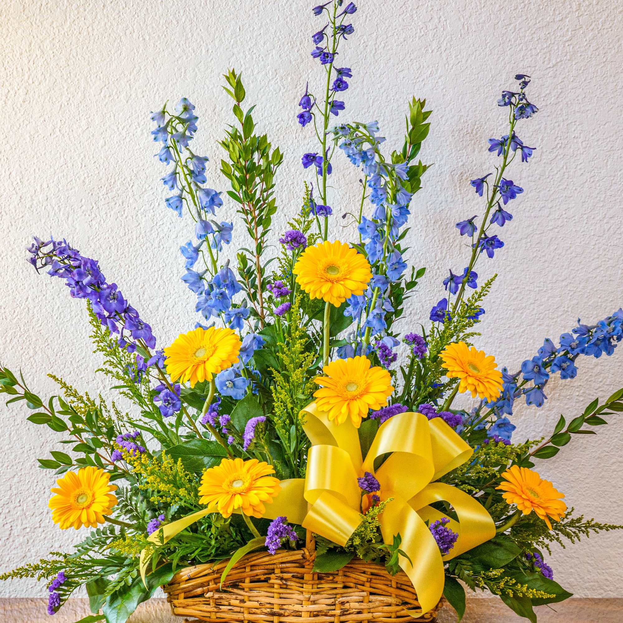 Celebrate a life well-lived with a cheery assortment of blue and yellow.