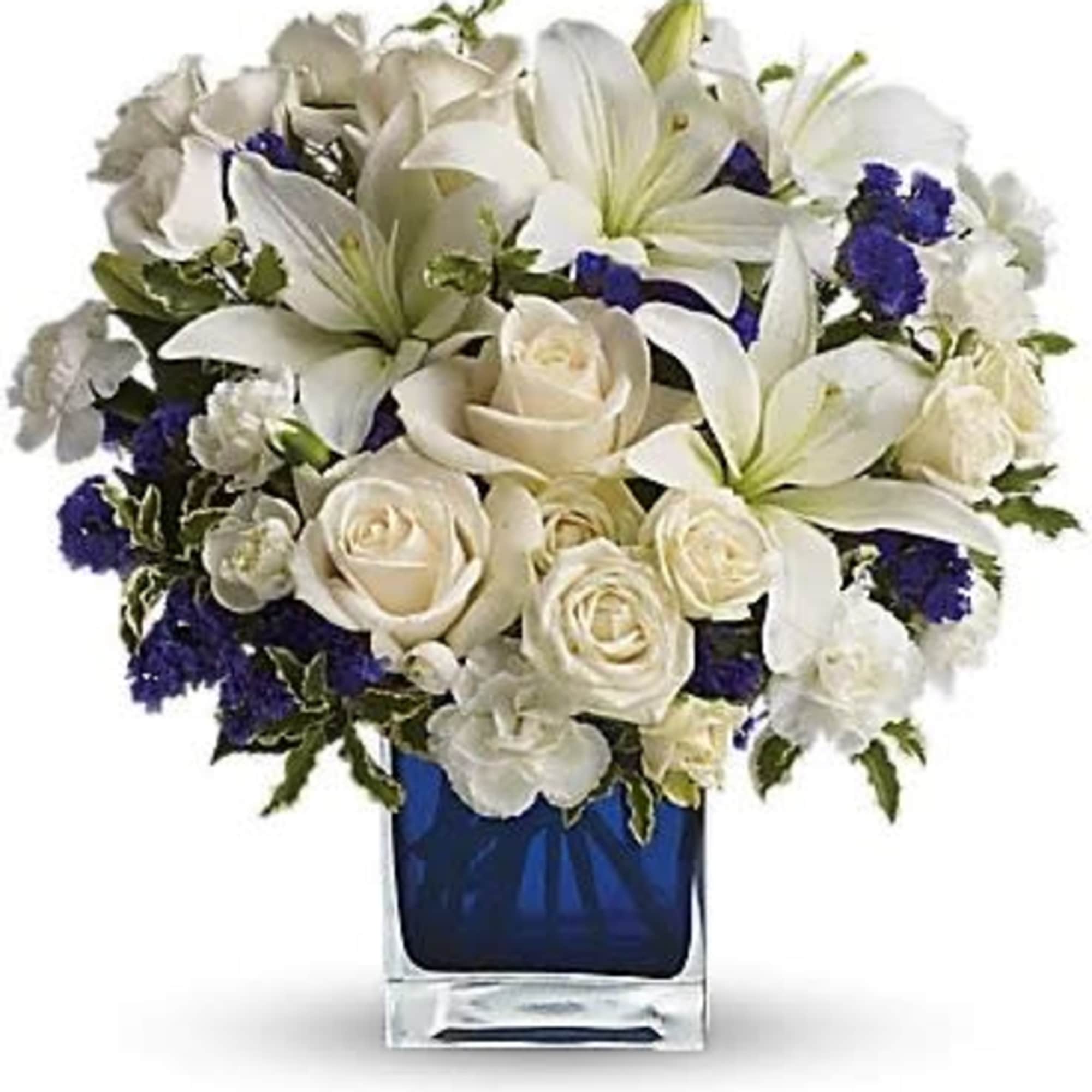 White lilies and roses arranged in a blue glass vase, photo 2 of 3