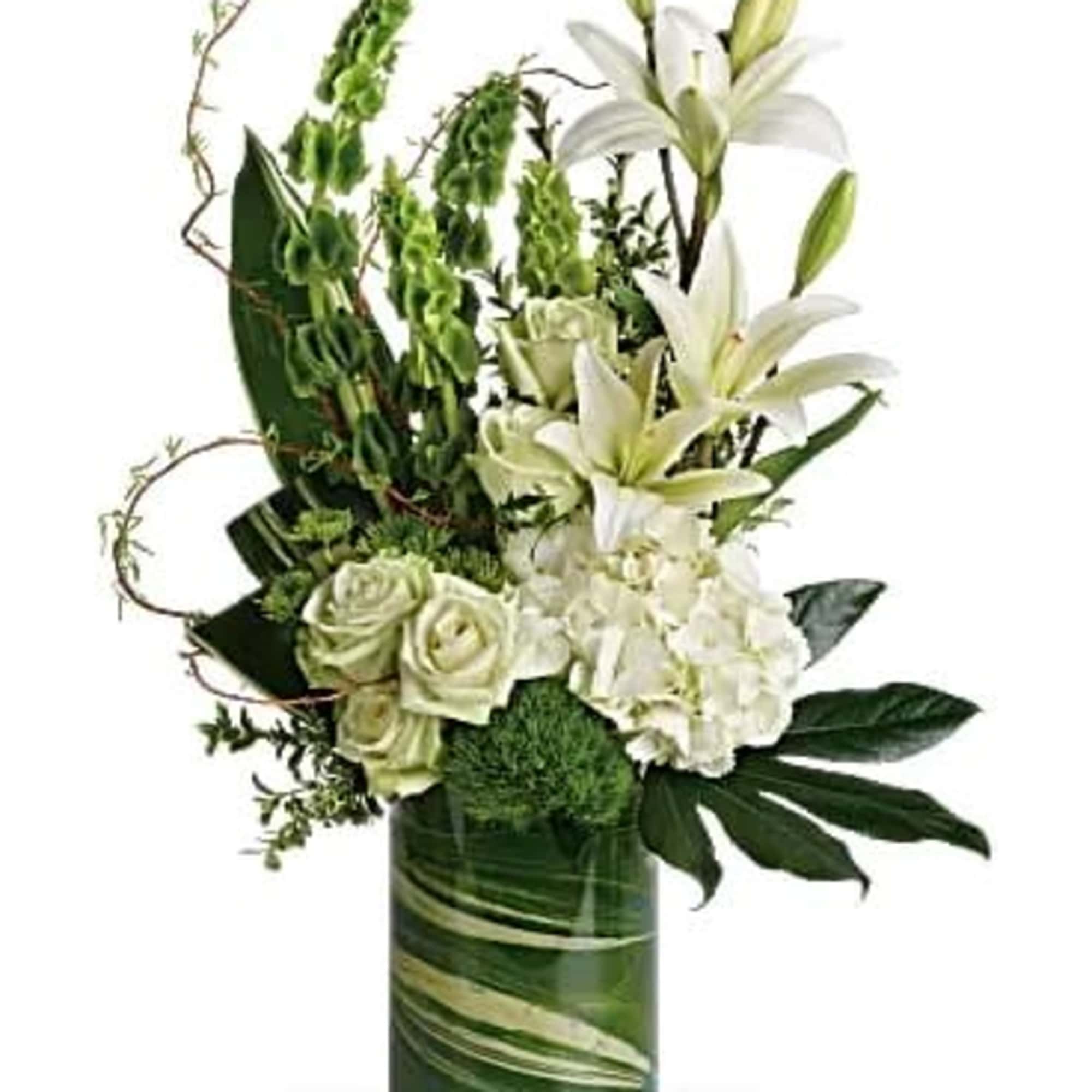 White lilies and roses arranged in a green glass vase, photo 2 of 3
