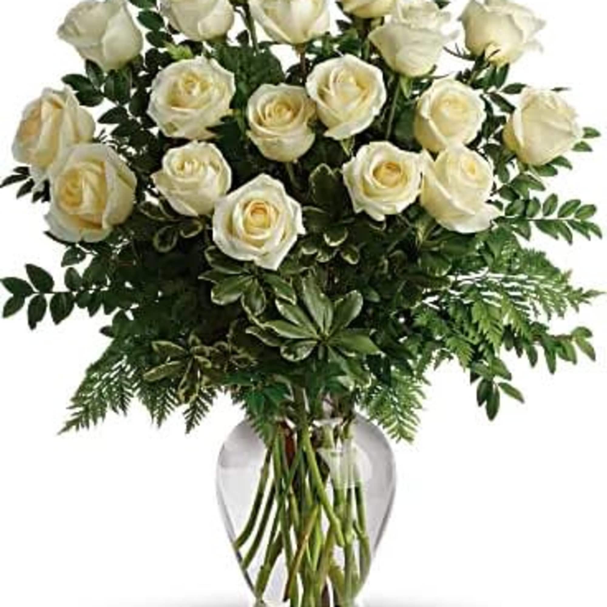 Bouquet of white roses in a clear glass vase, photo 2 of 3