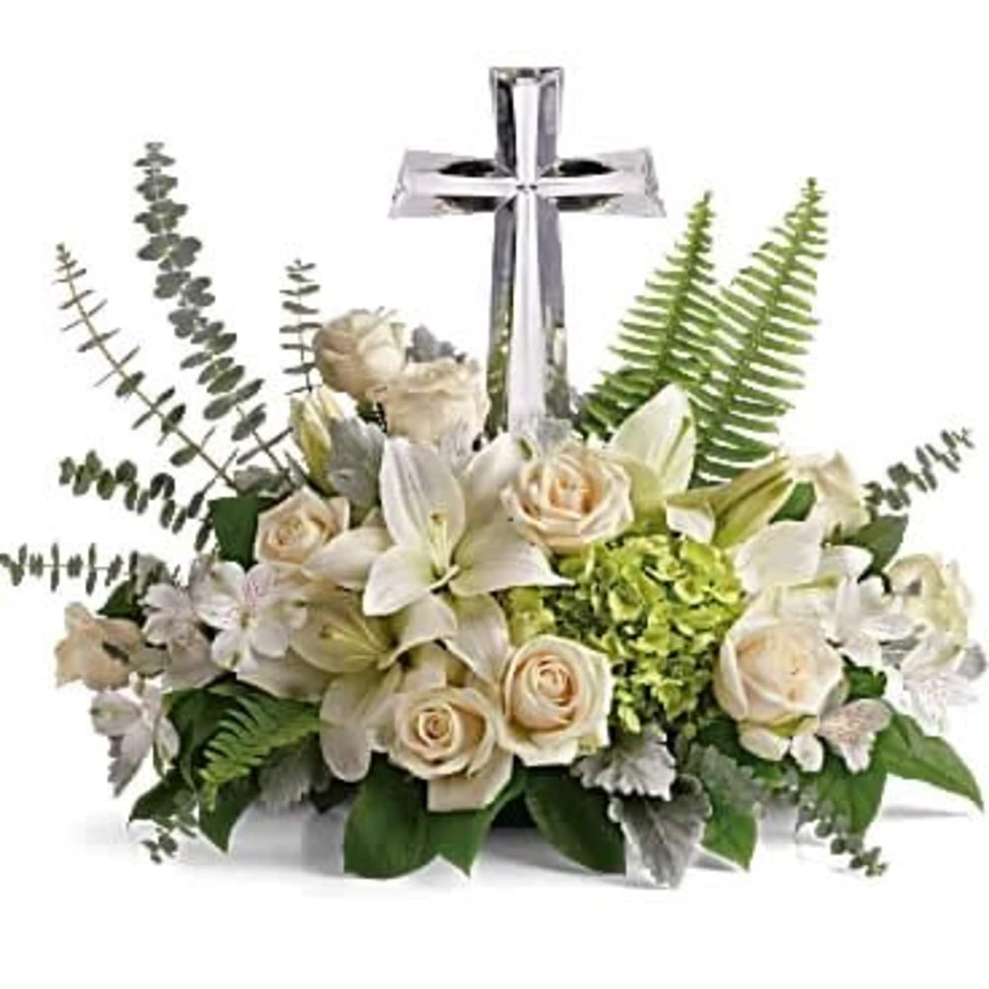 White floral arrangement with a silver cross centerpiece, photo 3 of 3