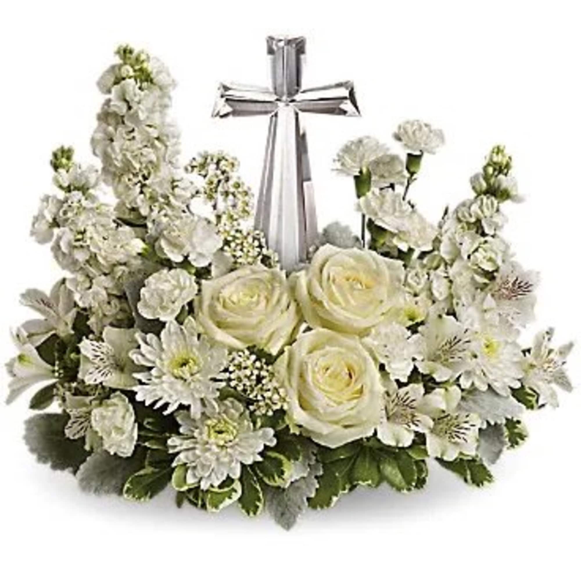 White floral wreath with a silver cross centerpiece