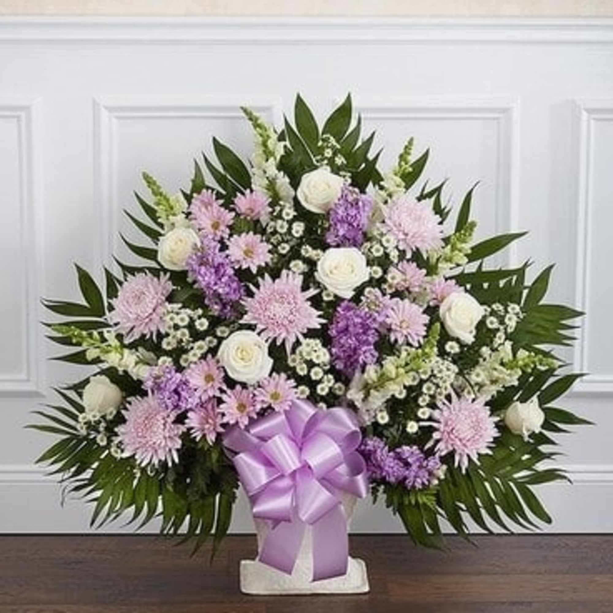 Lavender and white floral spray with a purple ribbon on a stand, photo 2 of 3