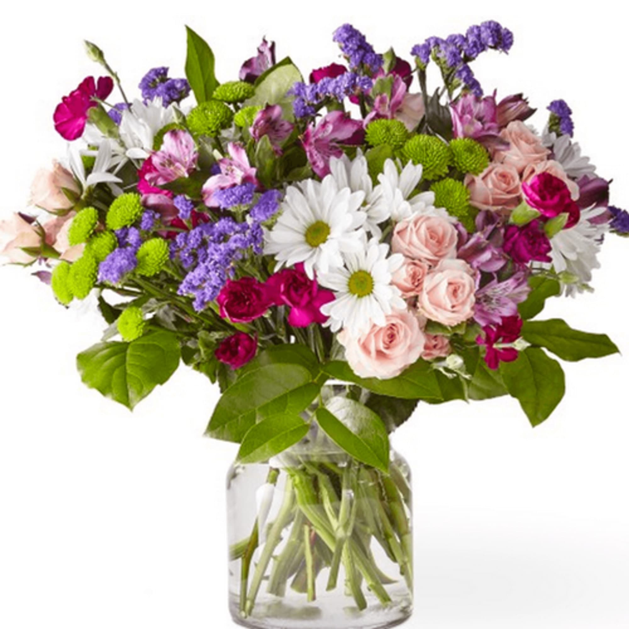 Mixed bouquet of pink roses, white daisies, and purple flowers in a glass vase