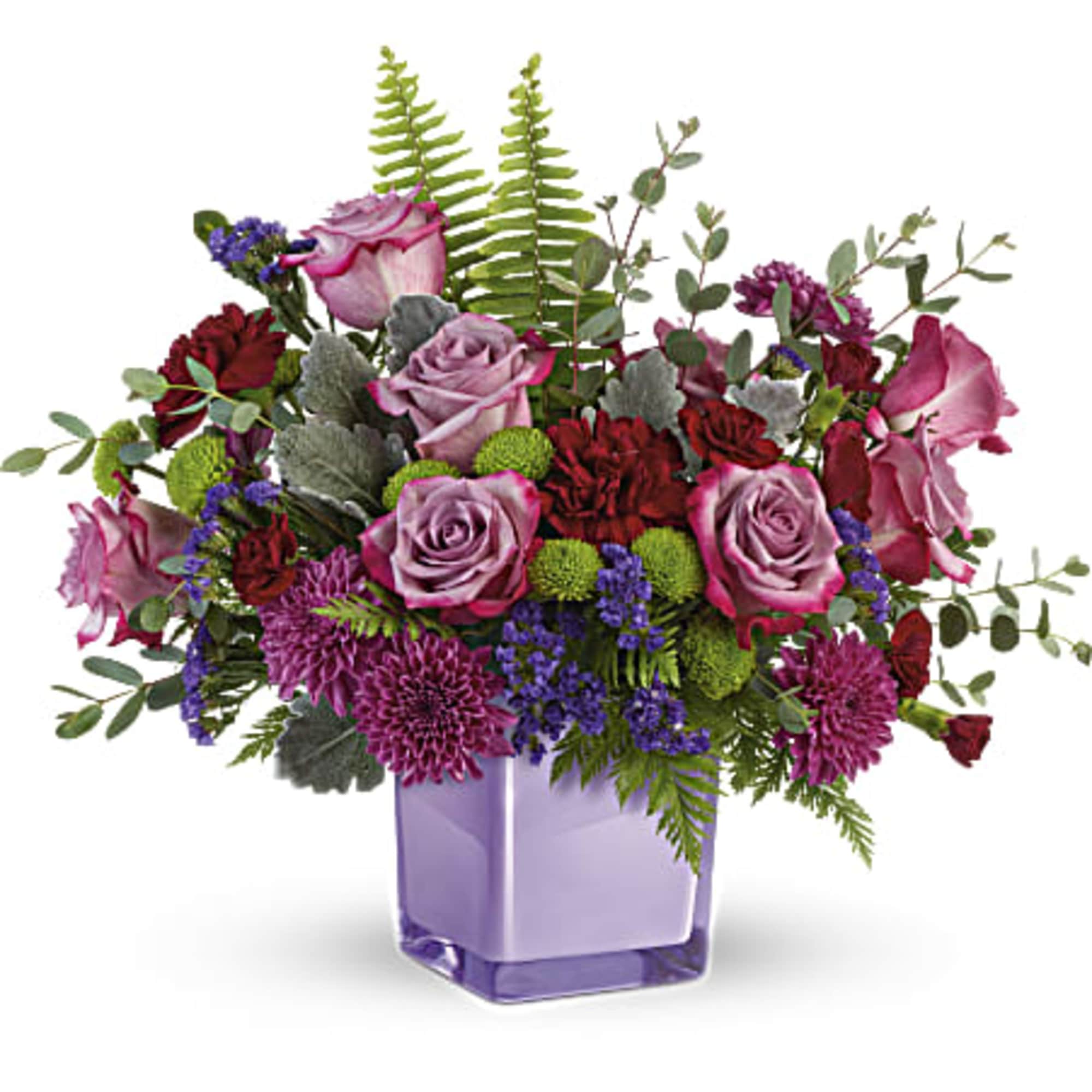 Lavender roses and purple flowers in a square glass vase