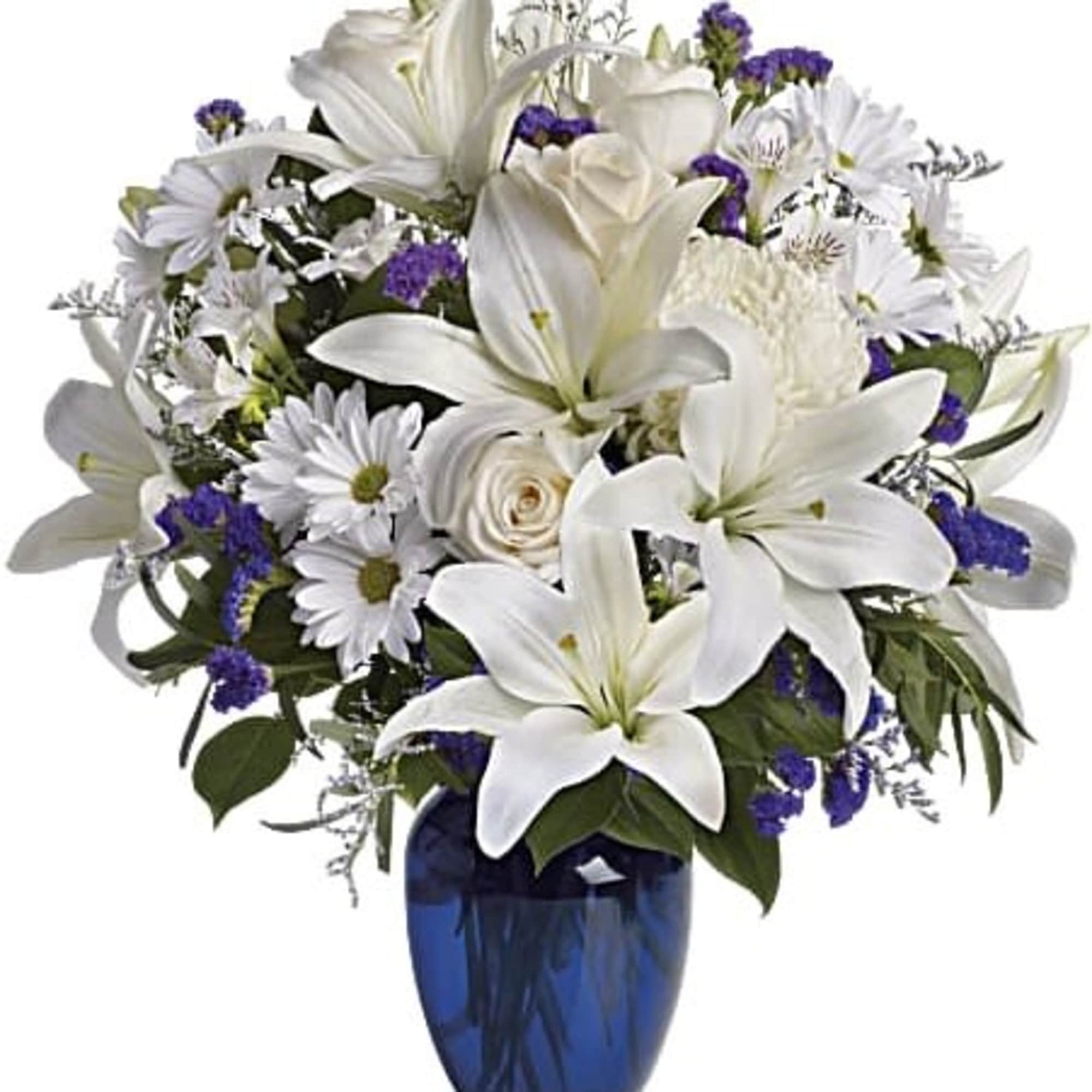 White lilies and daisies arranged in a blue vase