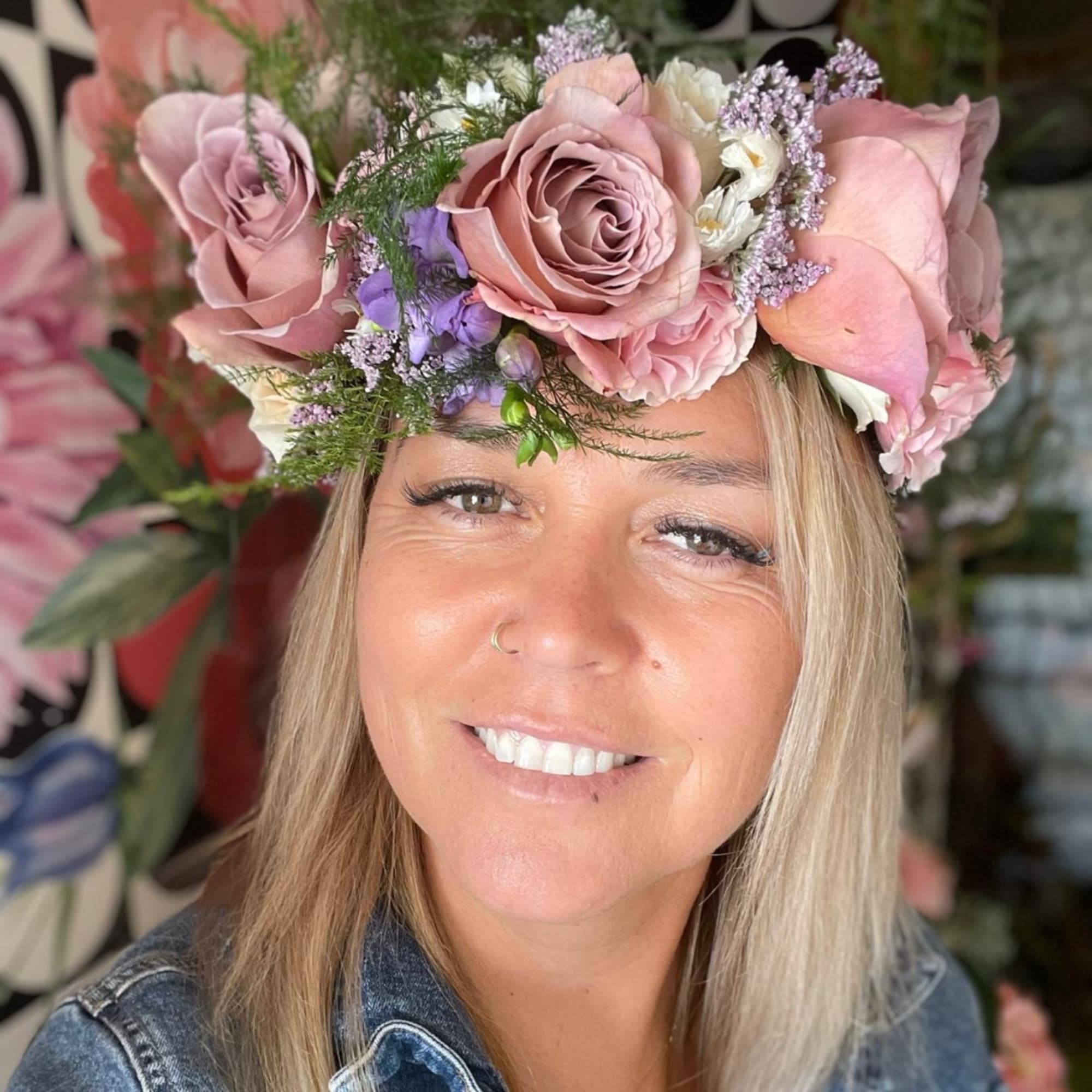 Woman wearing a pink and lavender flower crown