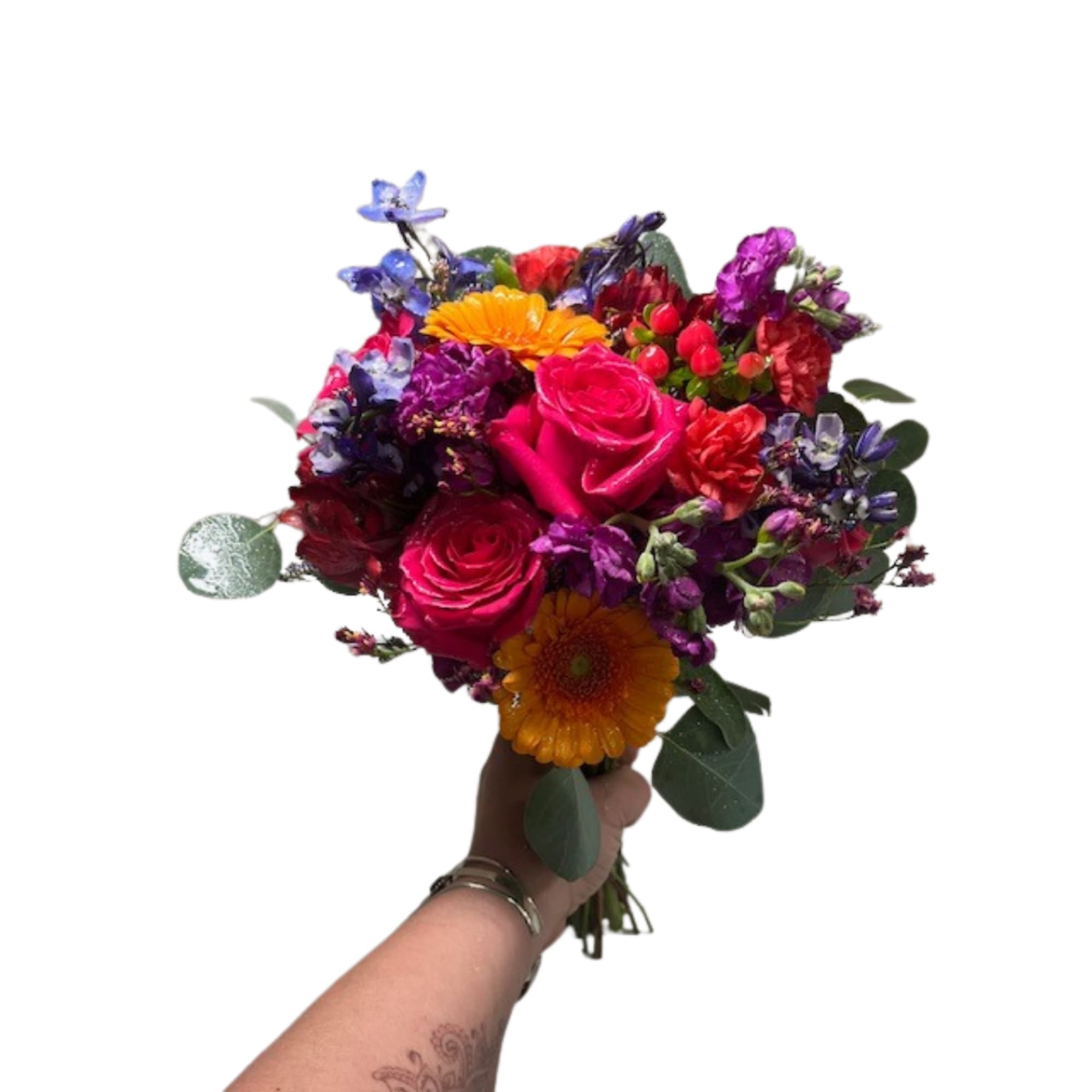 Handheld bouquet of bright mixed flowers in pink, purple, orange, and red