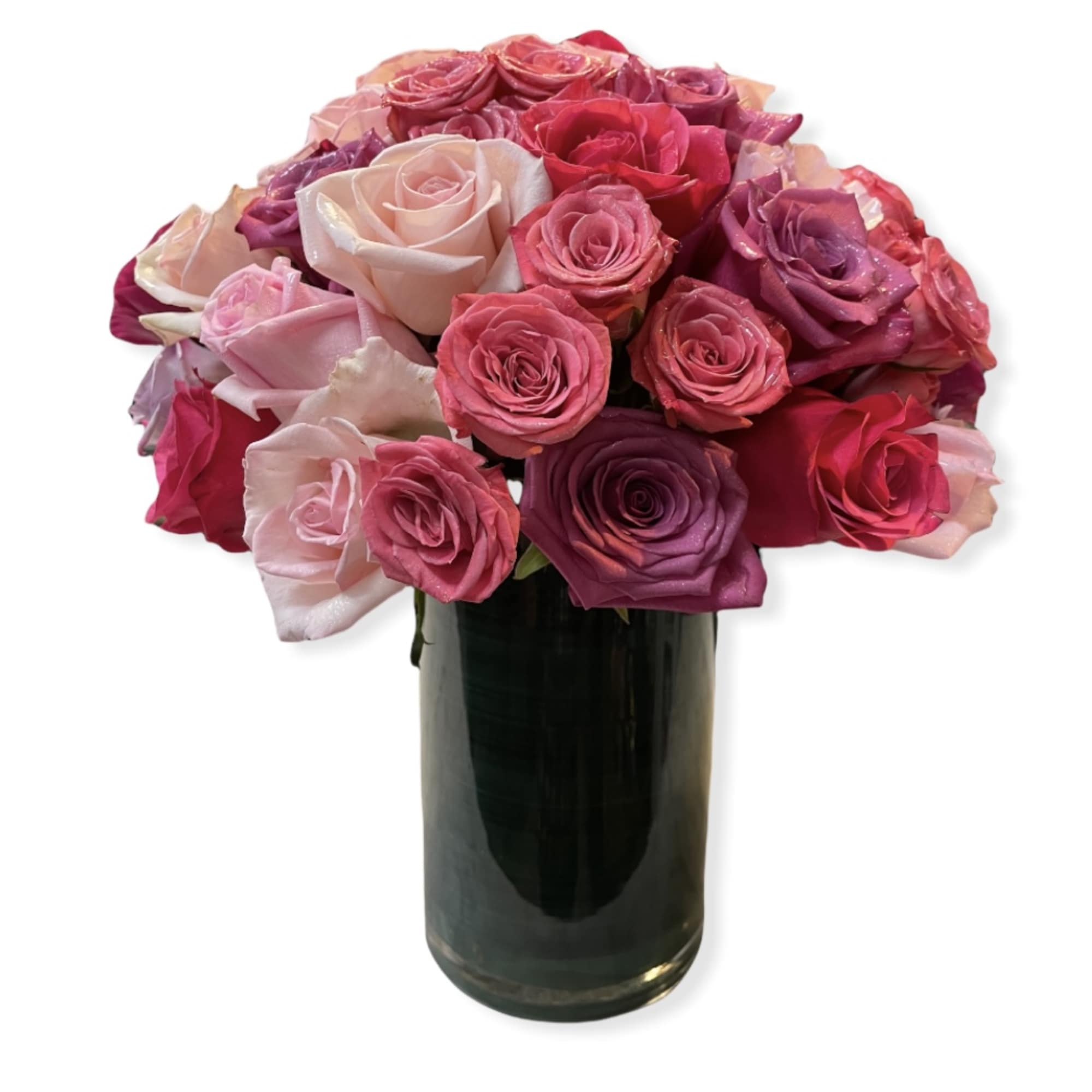 Bouquet of pink and purple roses in a dark glass vase