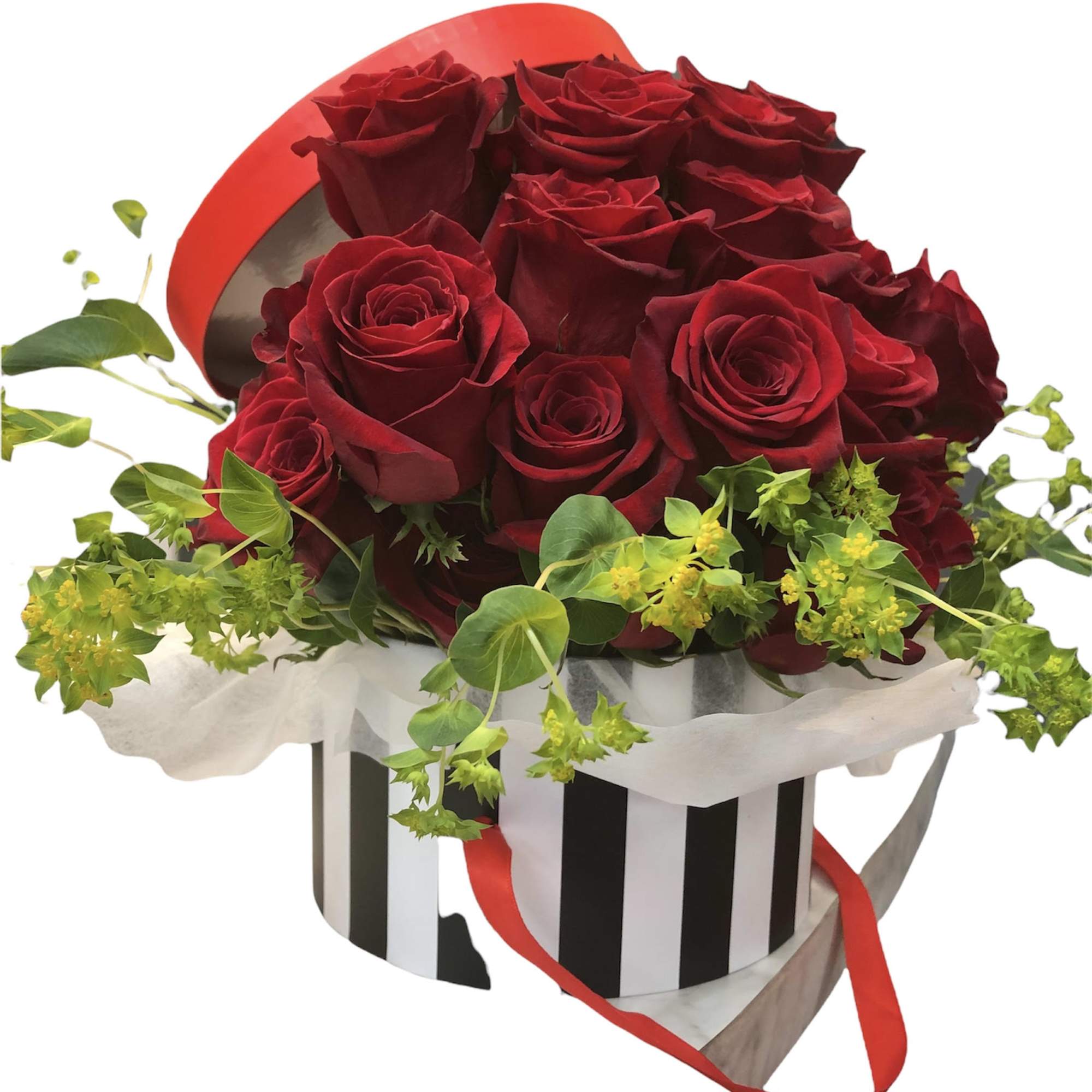 Red roses in a striped hatbox with trailing greenery