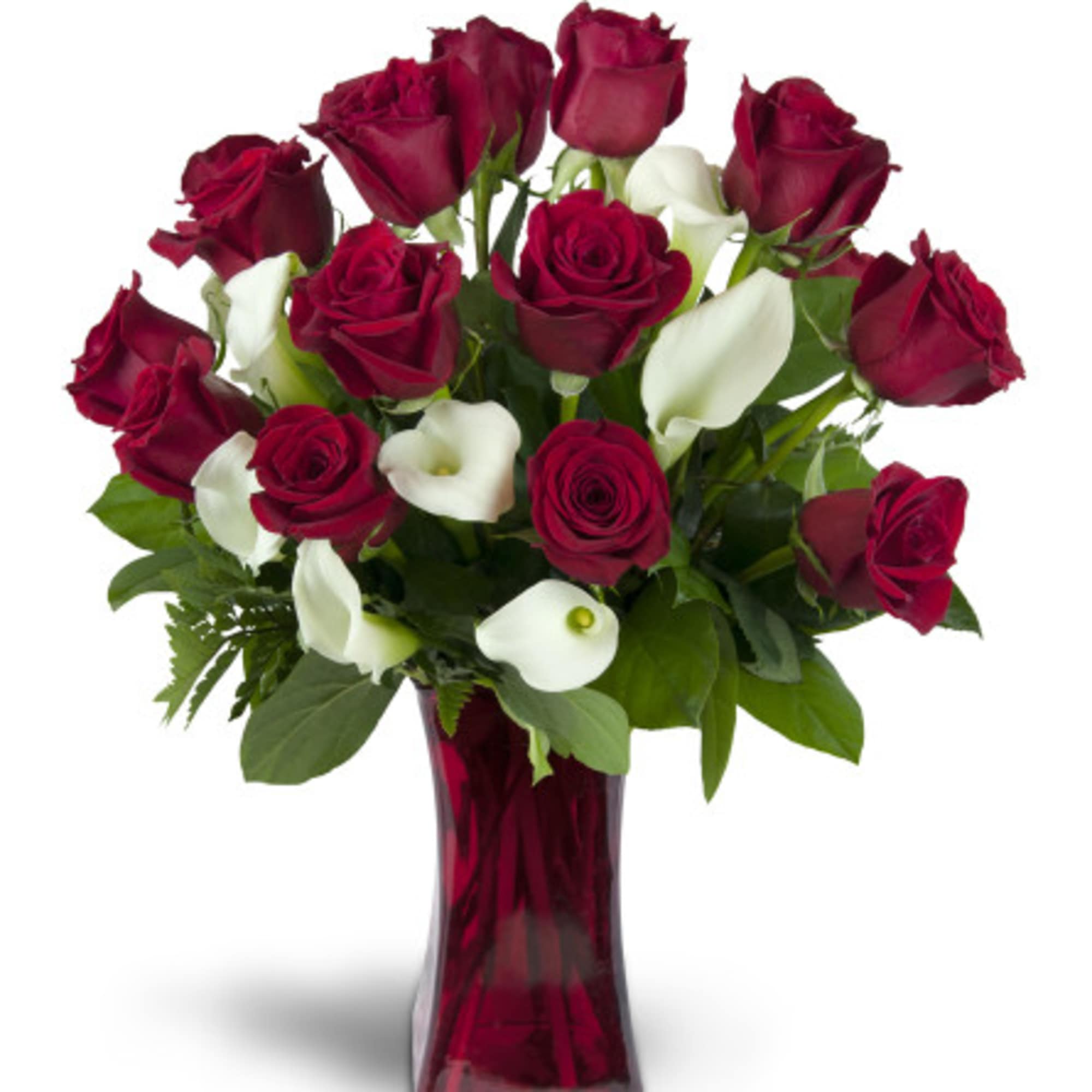 Red roses and white calla lilies in a red glass vase