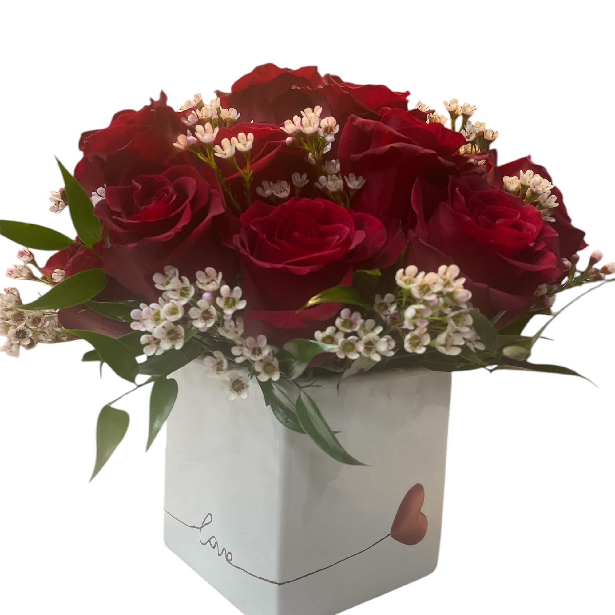 Red roses in a white box with small white filler flowers