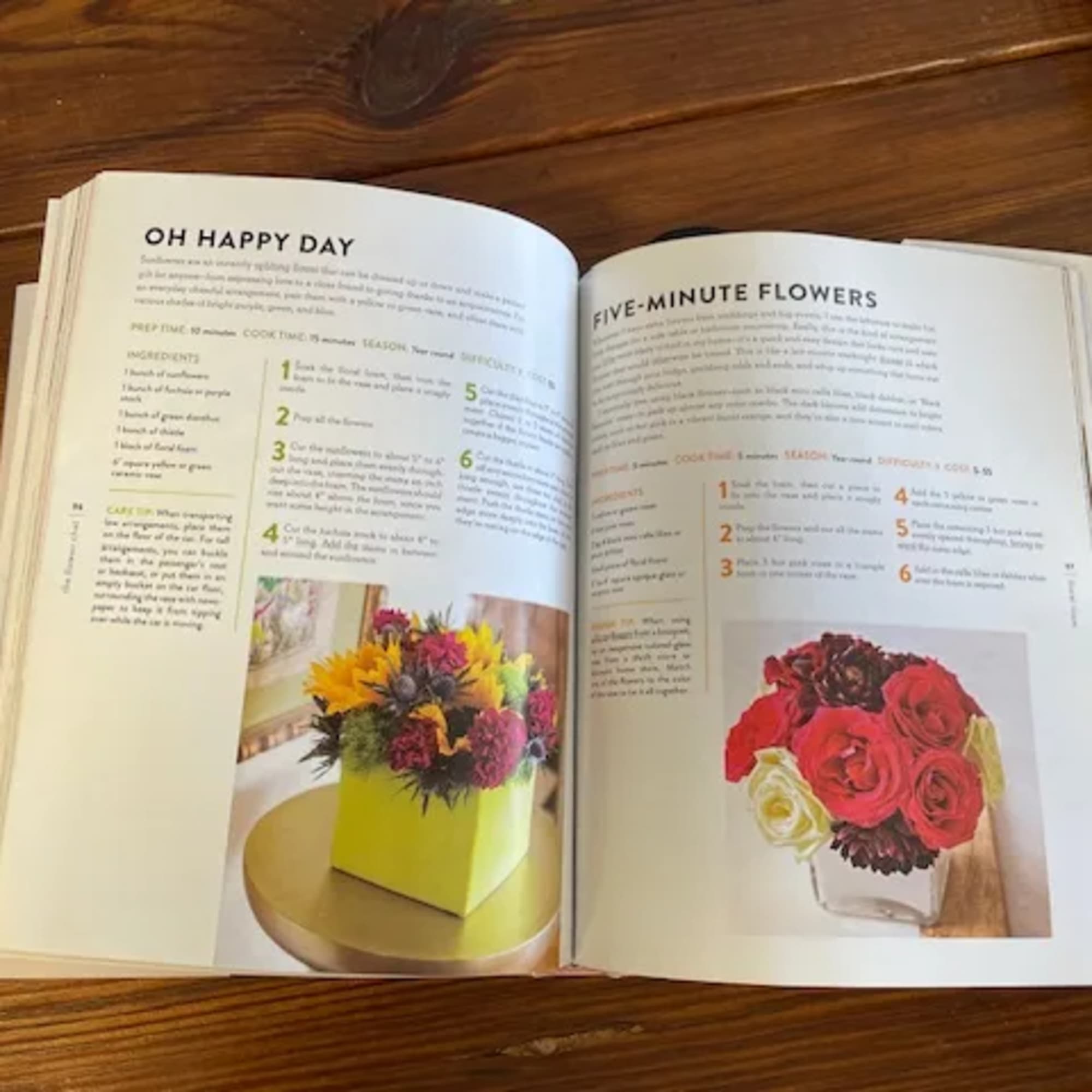 Open book showing floral arrangement photos on recipe pages