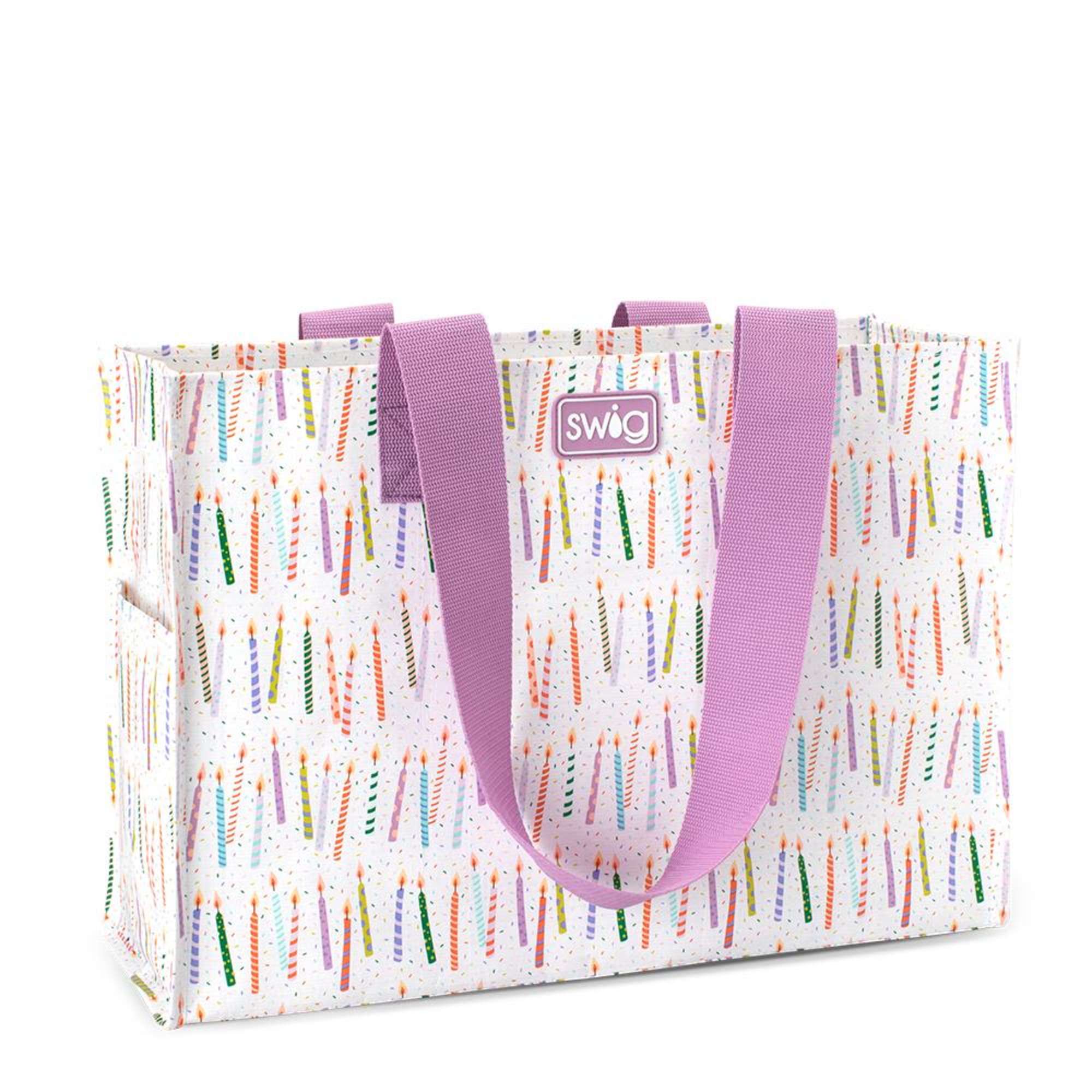 Patterned tote bag with pink handles and candle print