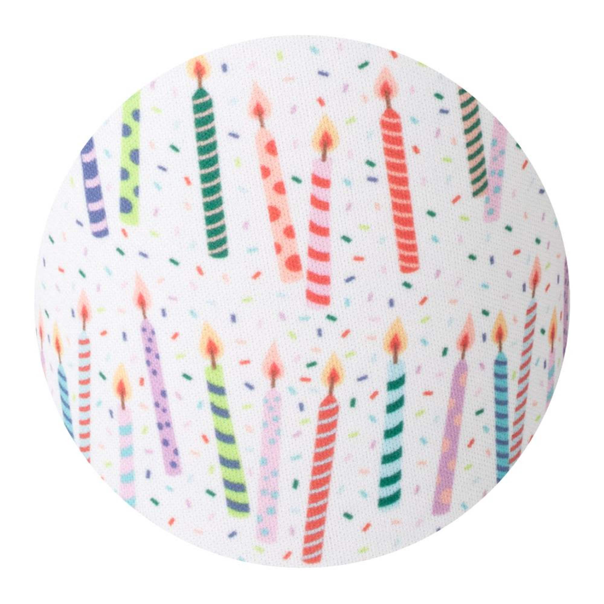 Patterned fabric with colorful birthday candles and confetti