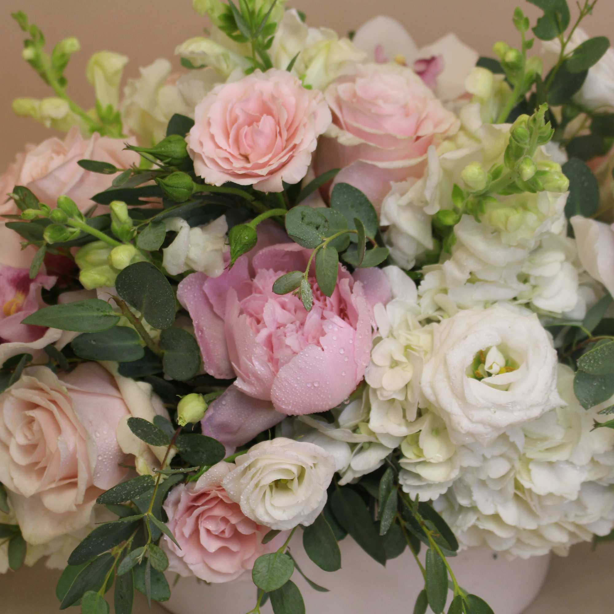 Soft blush roses and ruffled peonies nestle among creamy white hydrangeas and, photo 4 of 4