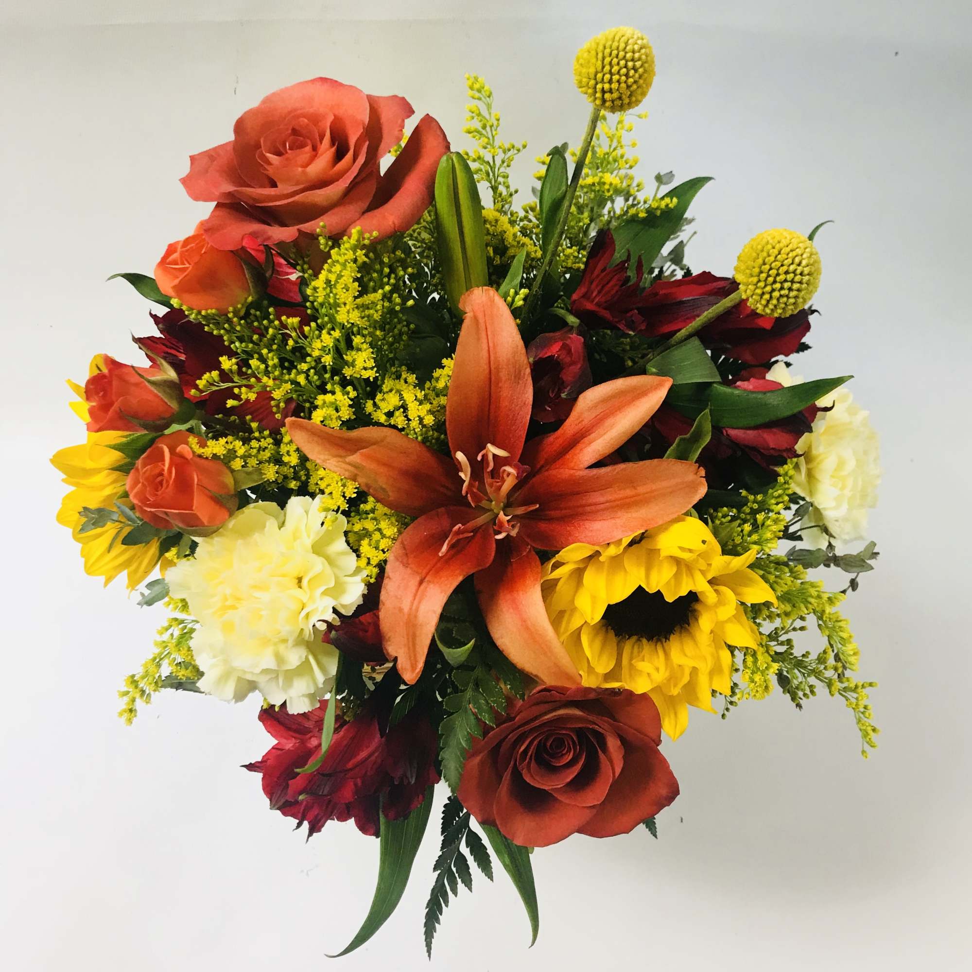 Mixed bouquet with roses, lilies, sunflowers, and carnations